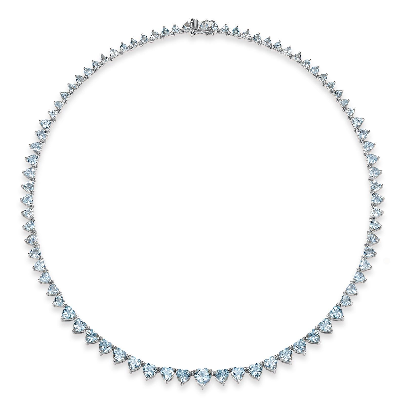 Make an unforgettable statement with Heart Aquamarine Riviera Graduated Tennis Necklace in White Gold. This exquisite necklace showcases a series of heart-shaped aquamarine gemstones, each radiating a serene, ocean-blue hue that adds a touch of