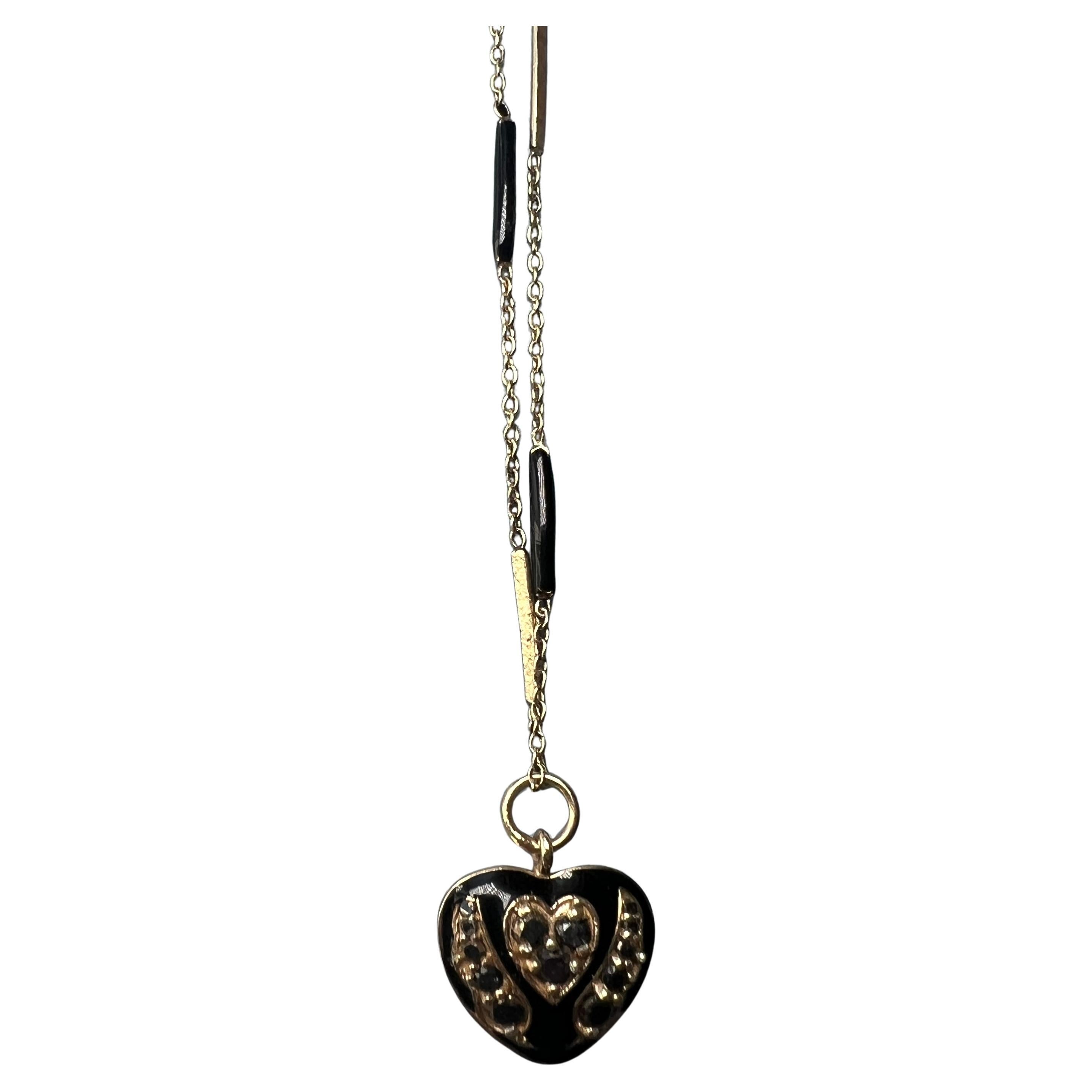 Heart Black Diamond Necklace Black Enamel 

Pendant: 14k Gold Plated Silver
Chain: 14k Gold Plated Silver

Length: Long 28