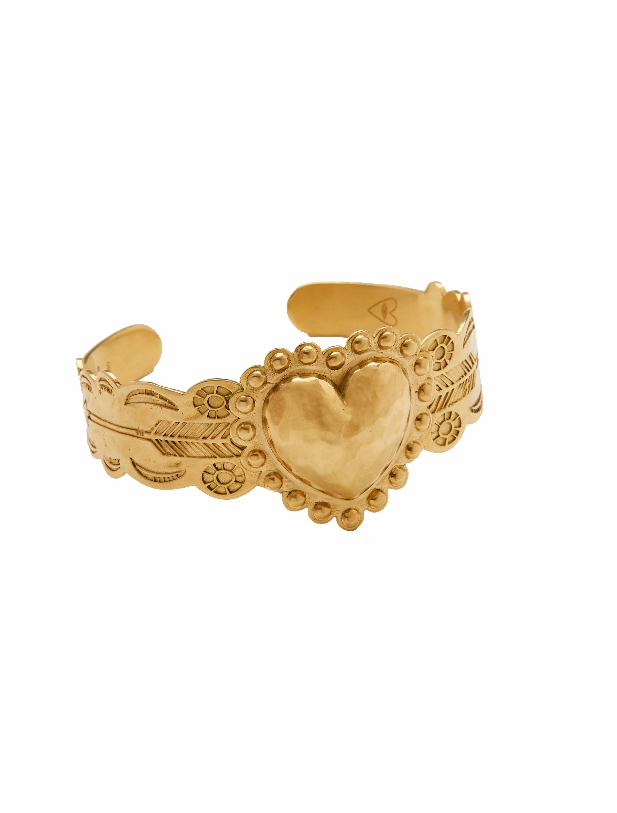 Heart cuff bracelet designed by Christina Alexiou.
The heart cuff bracelet is crafted with 18k yellow gold handmade in Greece. As Christina Alexiou notes, she draws on jewellery's ancient purpose as 