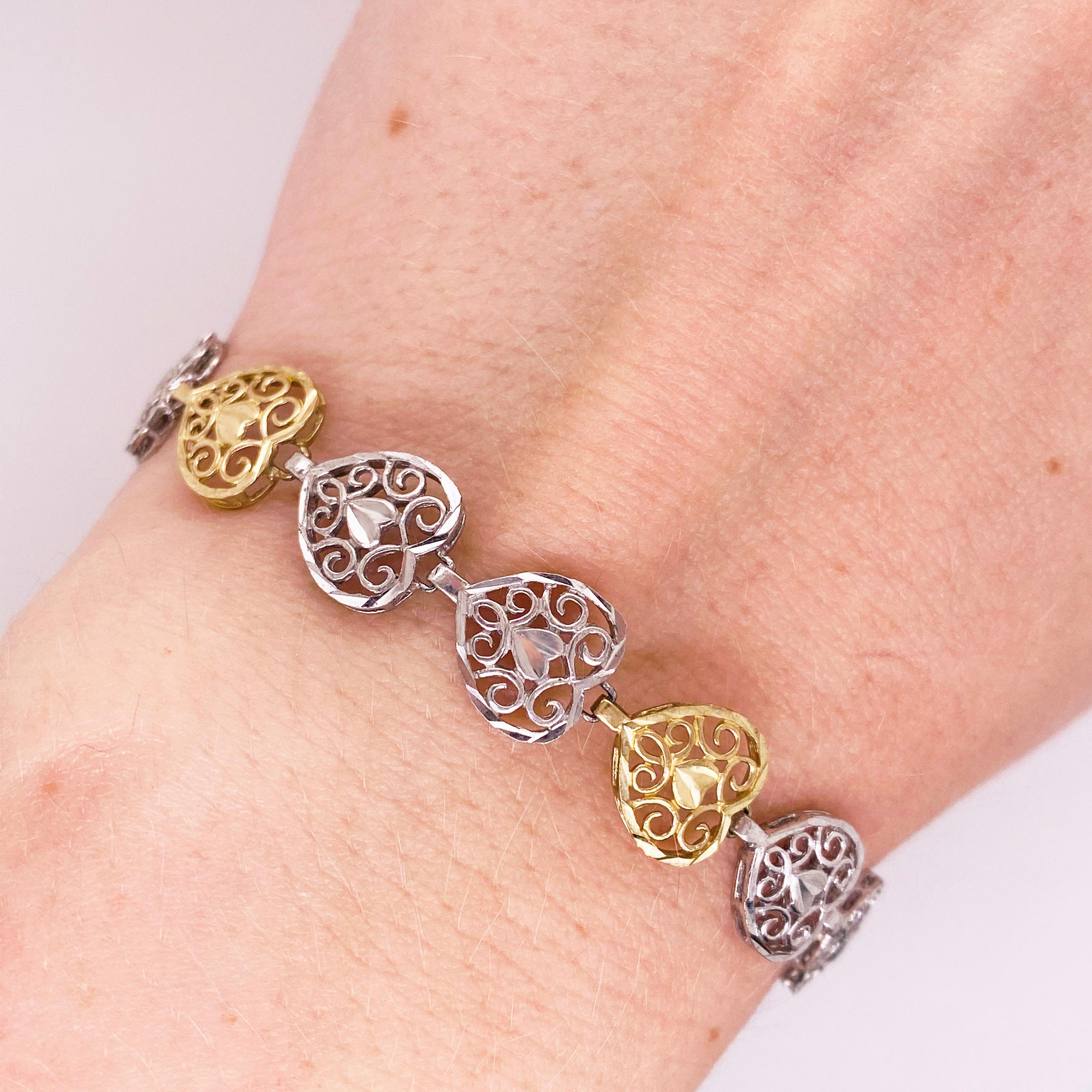 This filigree heart bracelet is so precious with its delicate hearts that are multi=metals.  Every other heart is 10 karat yellow gold and the others are precious sterling silver.  Its closure is a sturdy lobster clasp.   The bracelet is 7.25 inches