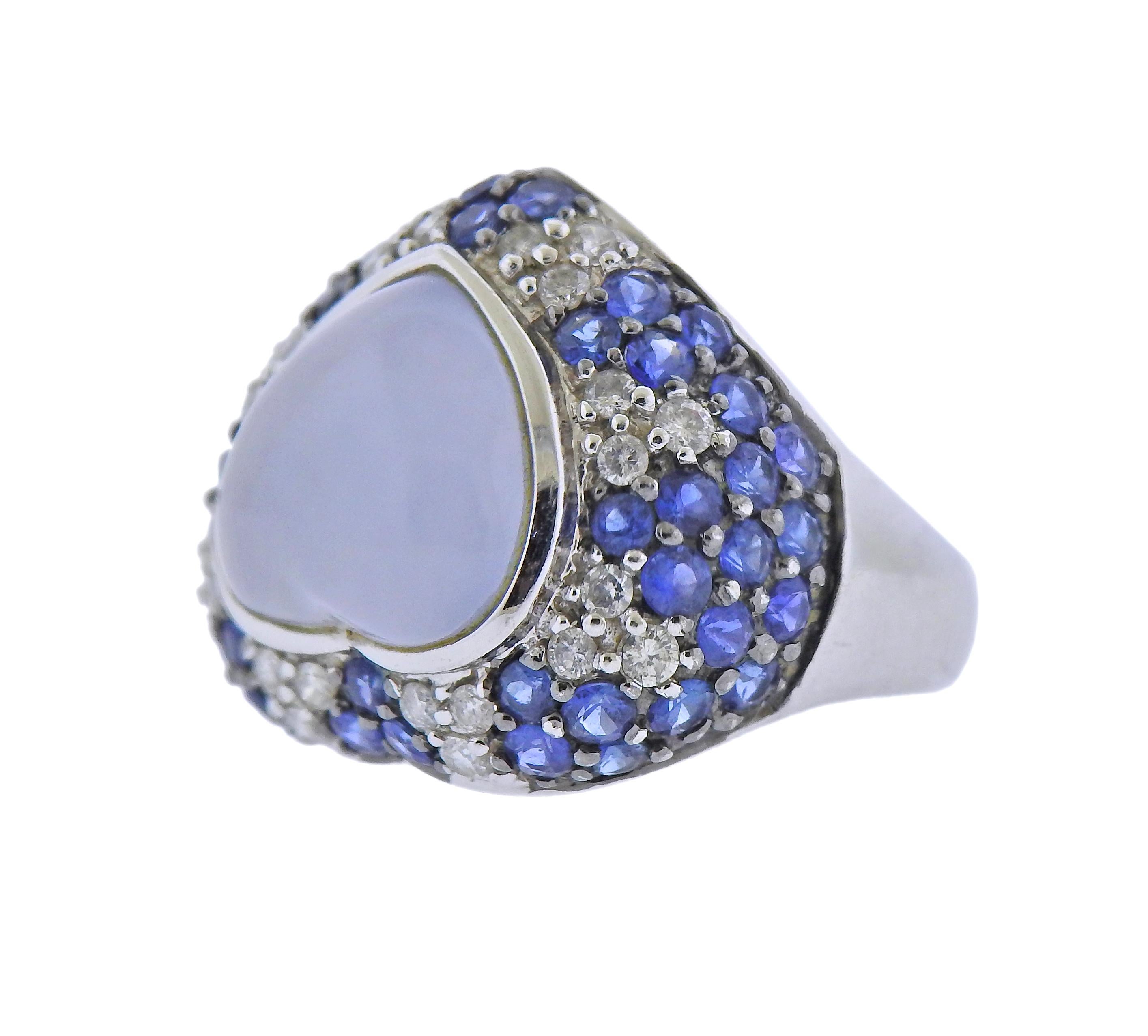 14k gold ring, set with heart shaped chalcedony, surrounded with blue sapphires and approx. 0.24ctw in diamonds. Ring size - 3.25, ring top - 18mm x 22mm. Marked: 14k 585. Weight - 7.2 grams.