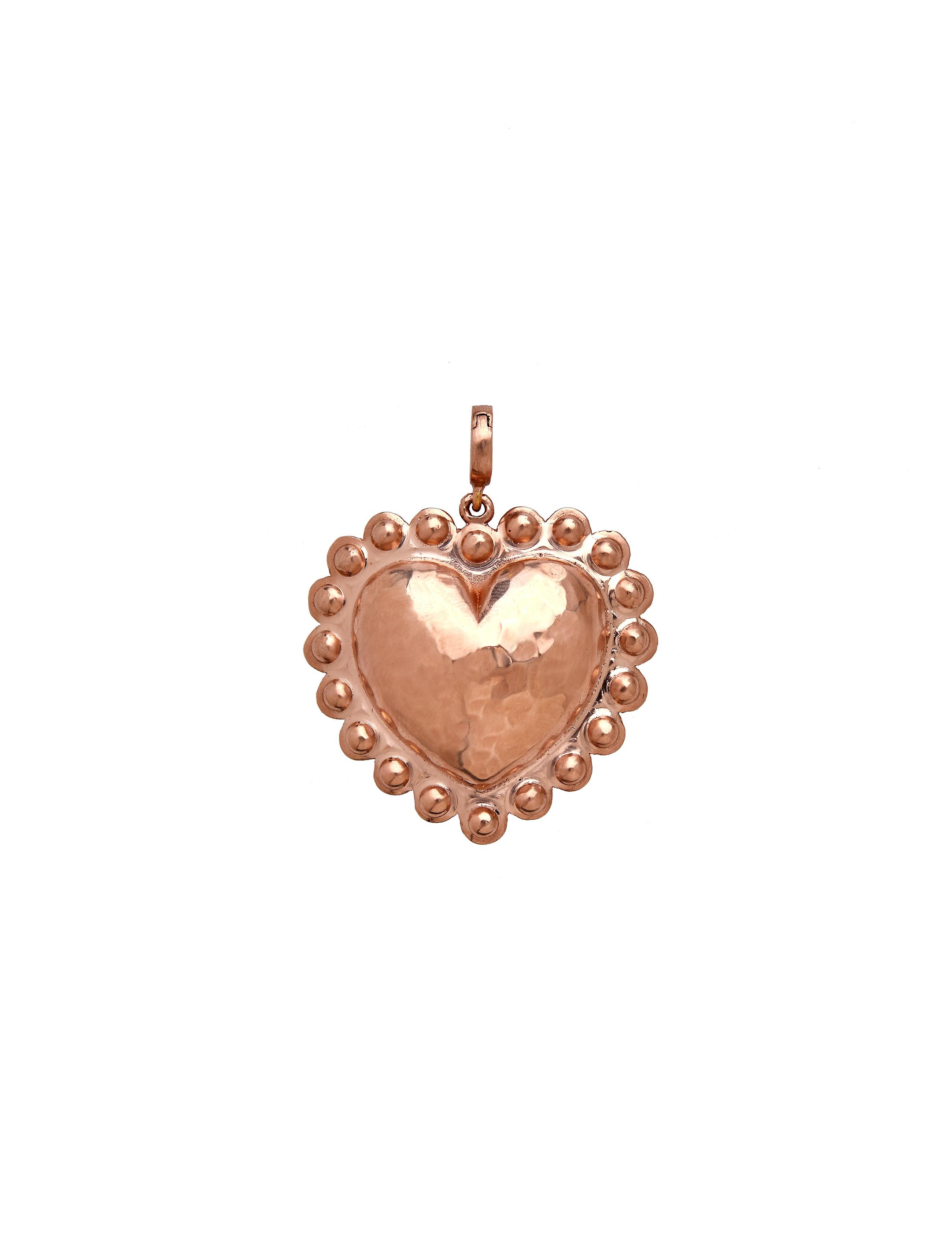 Heart charm deigned by Christina Alexiou. 
This beautiful charm is crafted with 18k yellow gold and made in Greece. The heart is hollow, thus makes it a light-weight everyday piece of jewelry. 
It is available in two colours, yellow and pink 18k