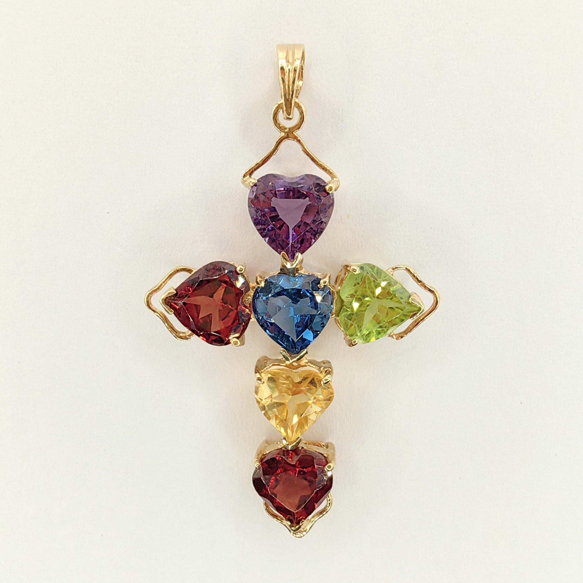 Introducing our Vintage Heart Cut Mixed Stones Cross Necklace Pendant in 14K Yellow Gold, a timeless piece of jewelry that exudes simple vintage charm while celebrating the elegance and individual significance of each gemstone.

This pendant