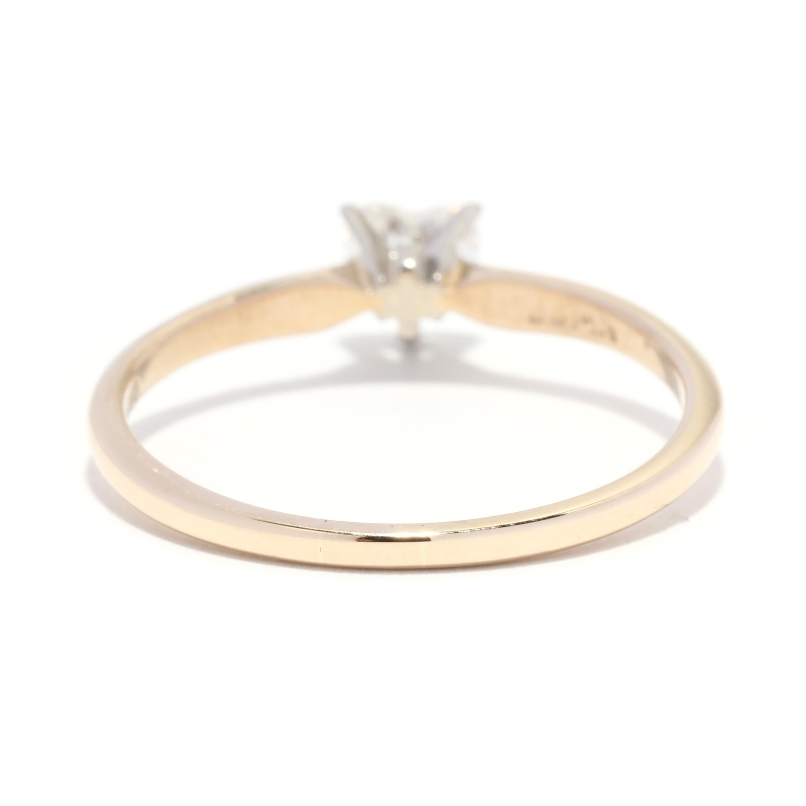 A vintage 14 karat yellow gold heart cut diamond solitaire engagement ring. This simple ring feature a prong set, heart cut diamond weighing approximately .25 carat and with a thin band.

Stones:
- diamond, 1 stone
- heart cut
- 4.6 x 3.8 x 2.5 mm
-