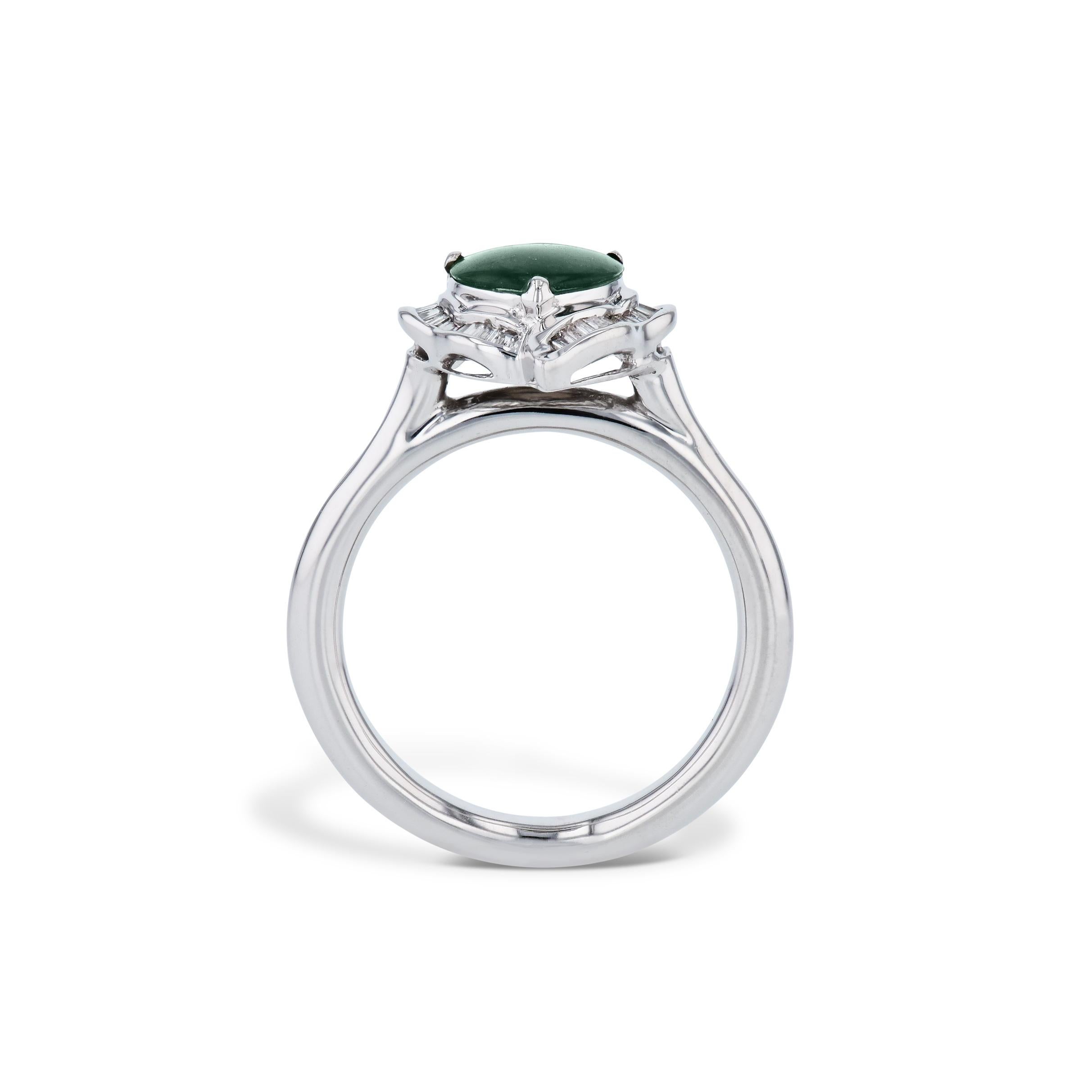 This Heart Cut Jadeite Cabochon Estate Ring is a stunningly beautiful piece that is sure to captivate! Featuring 32 baguette cut diamonds, exquisitely crafted in 14kt. white gold and sized to a 6. Don't miss the opportunity to own such a remarkable