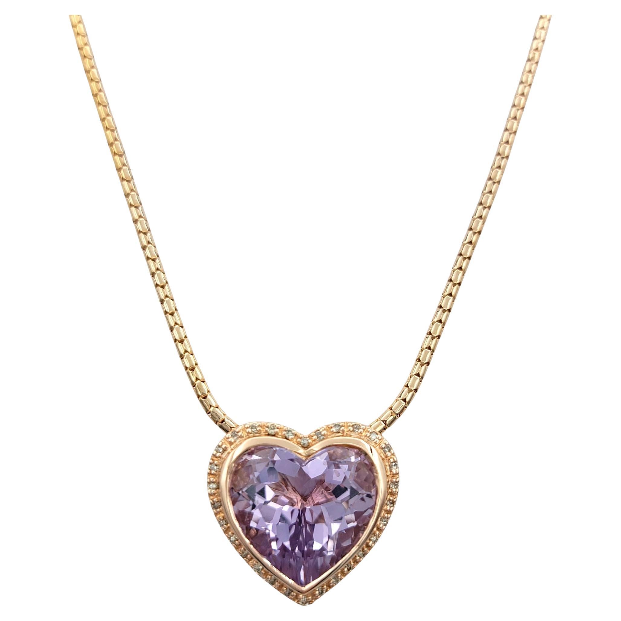 This romantic pendant features a stunning 8.51 carat heart-shaped morganite in a soft light purple hue. The center stone is framed by a delicate diamond halo that enhances its brilliance while maintaining an elegant, airy silhouette.

Set in 14