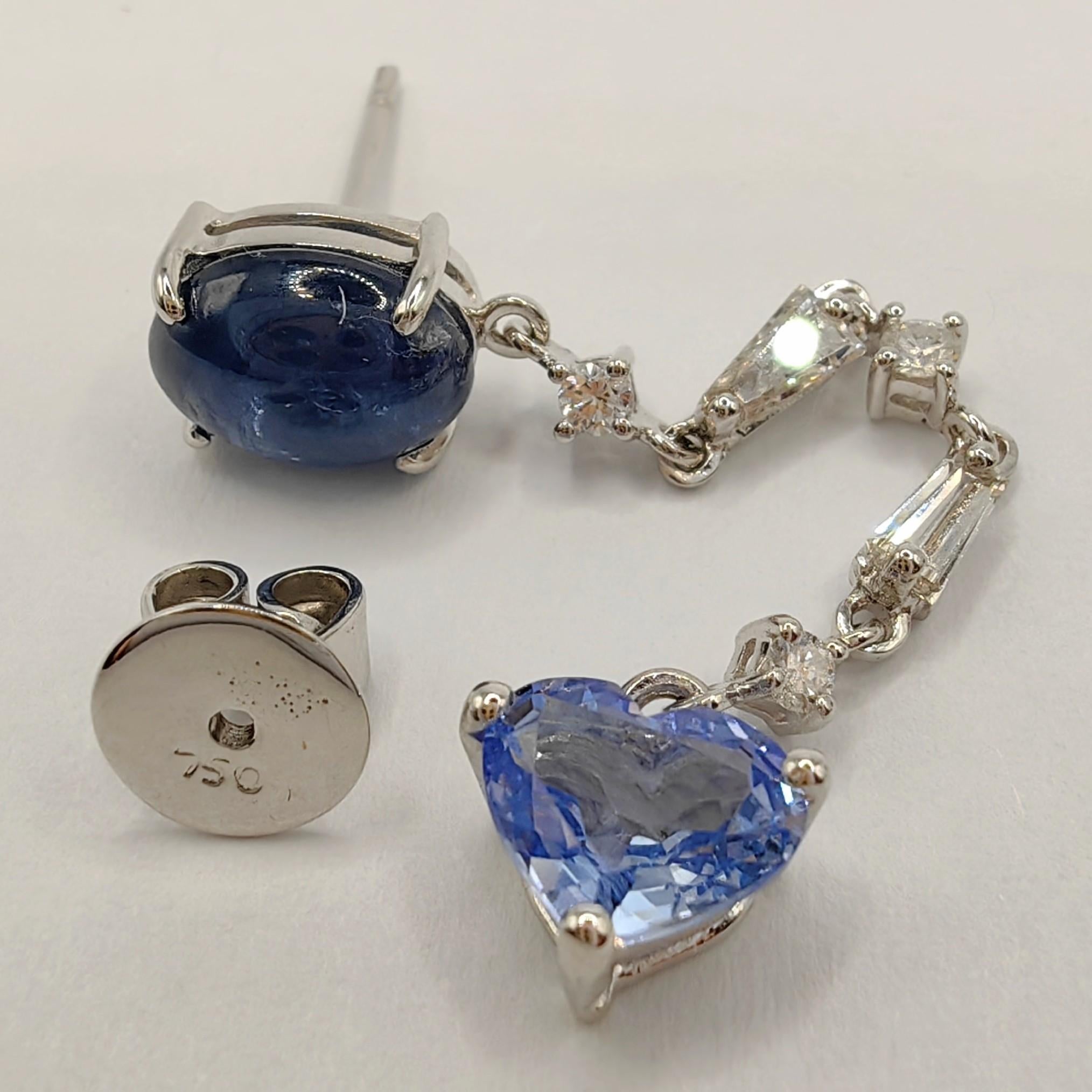 Unser pastellblauer Herz- und Cabochon-Saphir-Diamant-Ohrring aus 18-karätigem Weißgold ist ein einzigartiges Schmuckstück, das ein mutiges Modestatement setzt. Dieser Unisex-Ohrring ist nicht einfach nur ein Accessoire, er ist ein Ausdruck von
