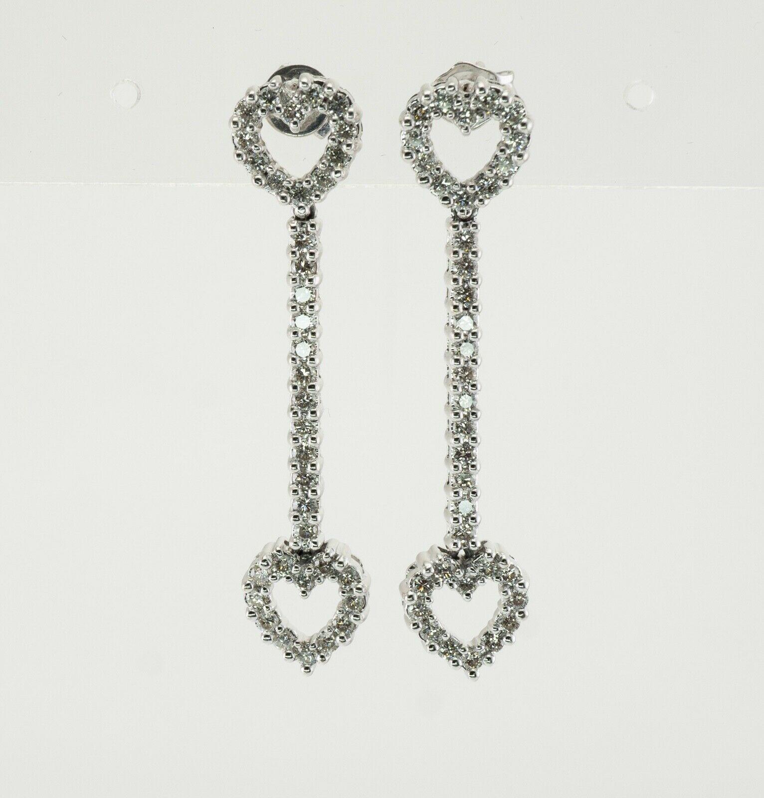Heart Diamond Earrings 14K White Gold Dangle 1.44 TDW

These gorgeous earrings are crafted in solid 14K White gold (carefully tested and guaranteed). Each earring holds 36 round brilliant cut diamonds. The diamonds are SI1-SI2 clarity and H color