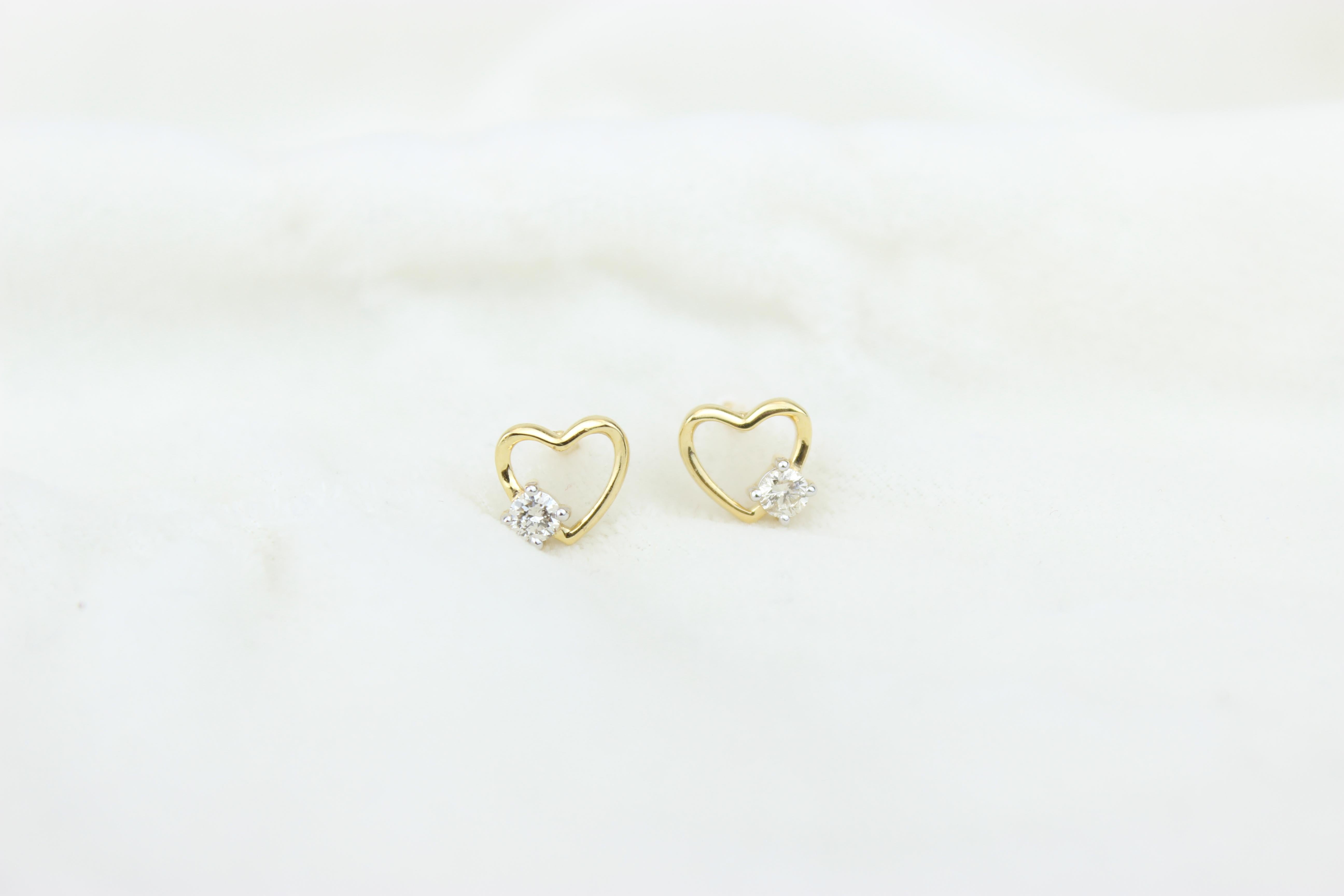 
Heart Diamond Earrings for Girls (Kids/Toddlers) in 18K Solid Gold are adorable and sweet jewelry pieces designed for young children. These earrings showcase a delightful heart-shaped design crafted from high-quality 18K solid gold, ensuring