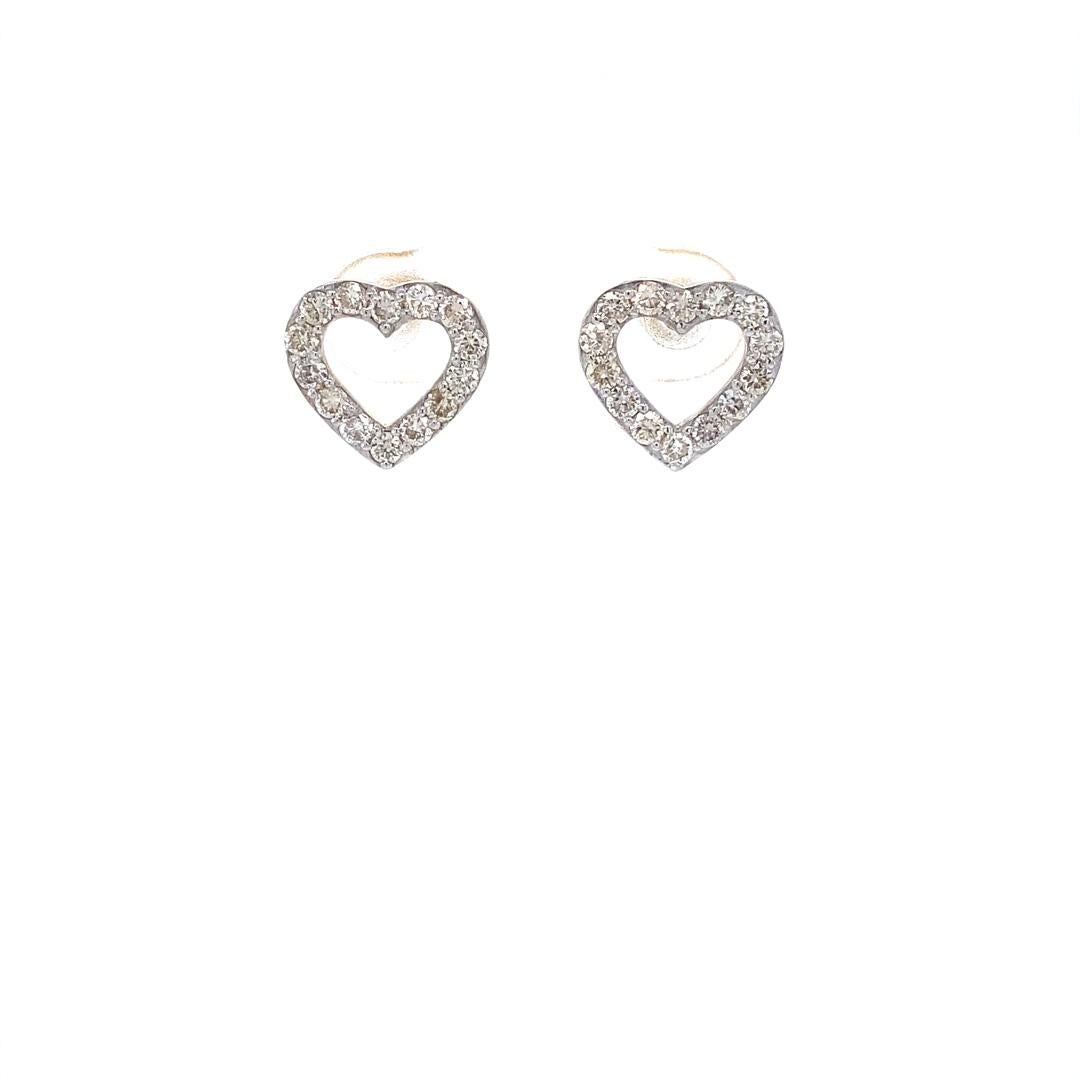 Heart diamond earrings for girls, kids, and toddlers in 18K solid gold combine elegance with a touch of youthful charm. Crafted with precision and care, these dainty earrings feature a heart-shaped design adorned with sparkling diamonds, adding a