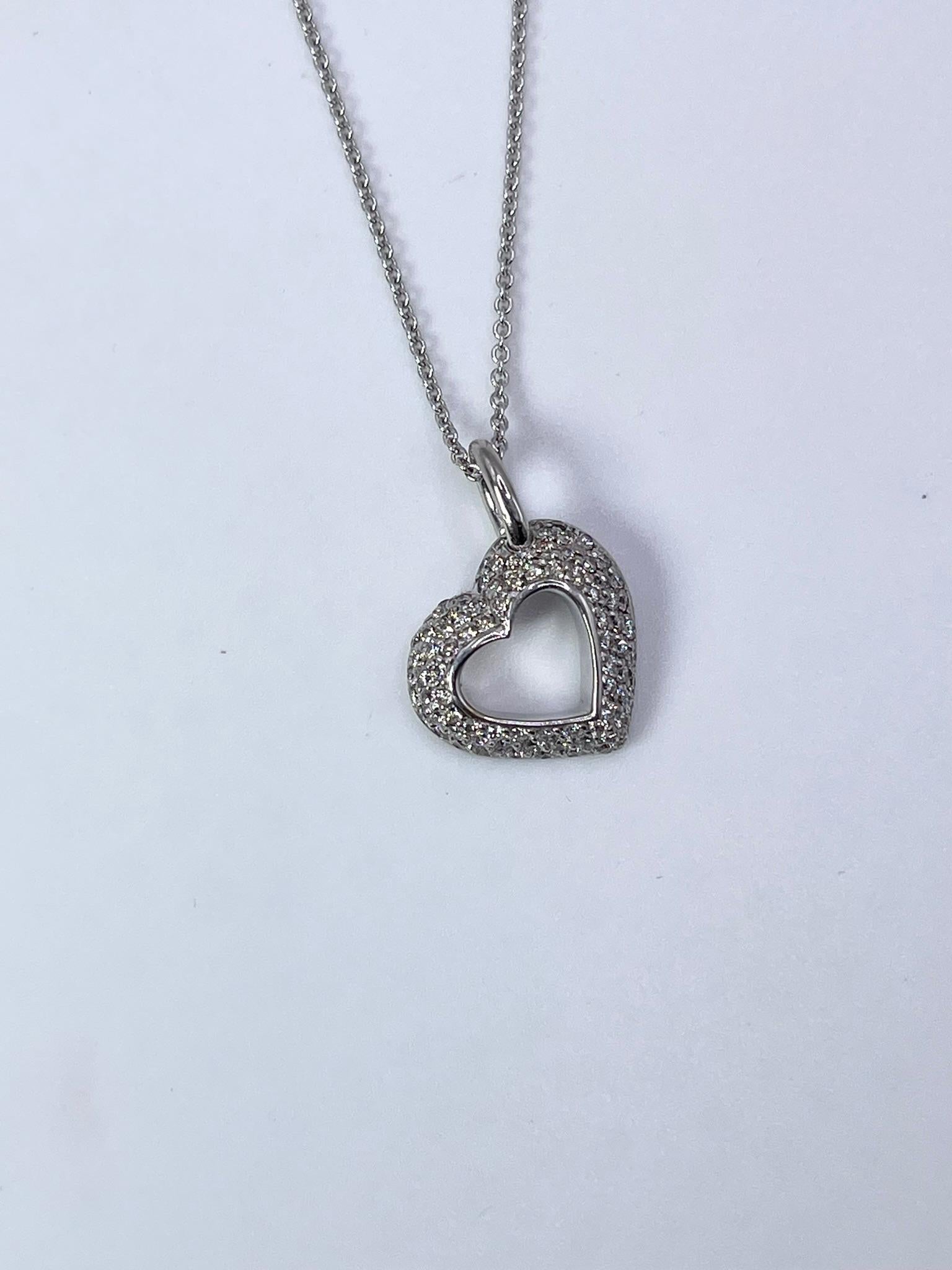Heart diamond pendant necklace in 14KT white gold, diamonds are set with pave setting style.

GRAM WEIGHT: 6.29gr
GOLD: 14KT white gold
NECKLACE chain-18