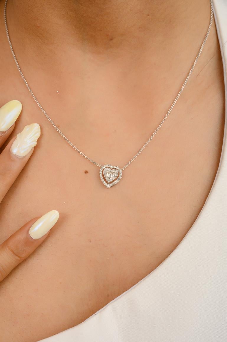 Heart Diamond Pendant Necklace in 18K Gold studded with round cut diamond. This stunning piece of jewelry instantly elevates a casual look or dressy outfit. 
April birthstone diamond brings love, fame, success and prosperity.
Designed with diamond