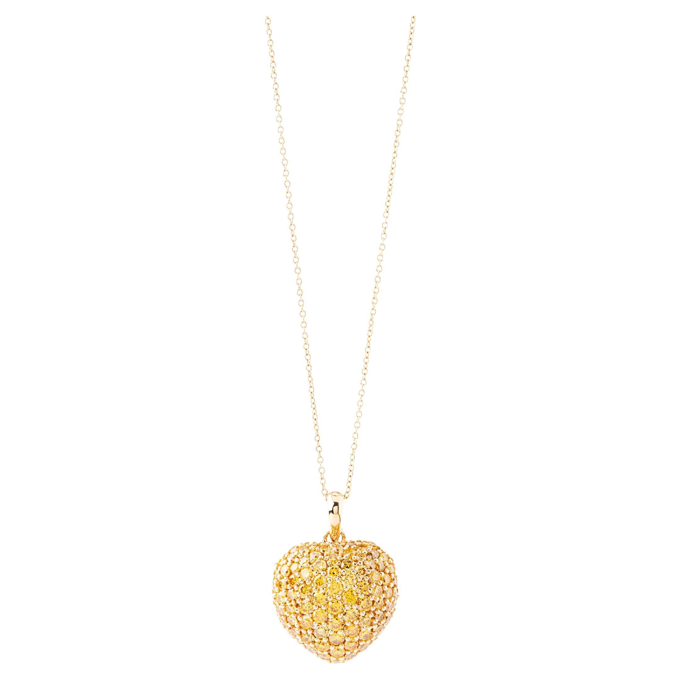 Handcrafted 18k Gold Pendant, with Fancy Vivid Yellow Diamonds of the highest quality. Natural without any treatment. The pendant or necklace enhancer is made of 10 grams 18k gold. The canary yellow diamonds are hand set on the heart and shine