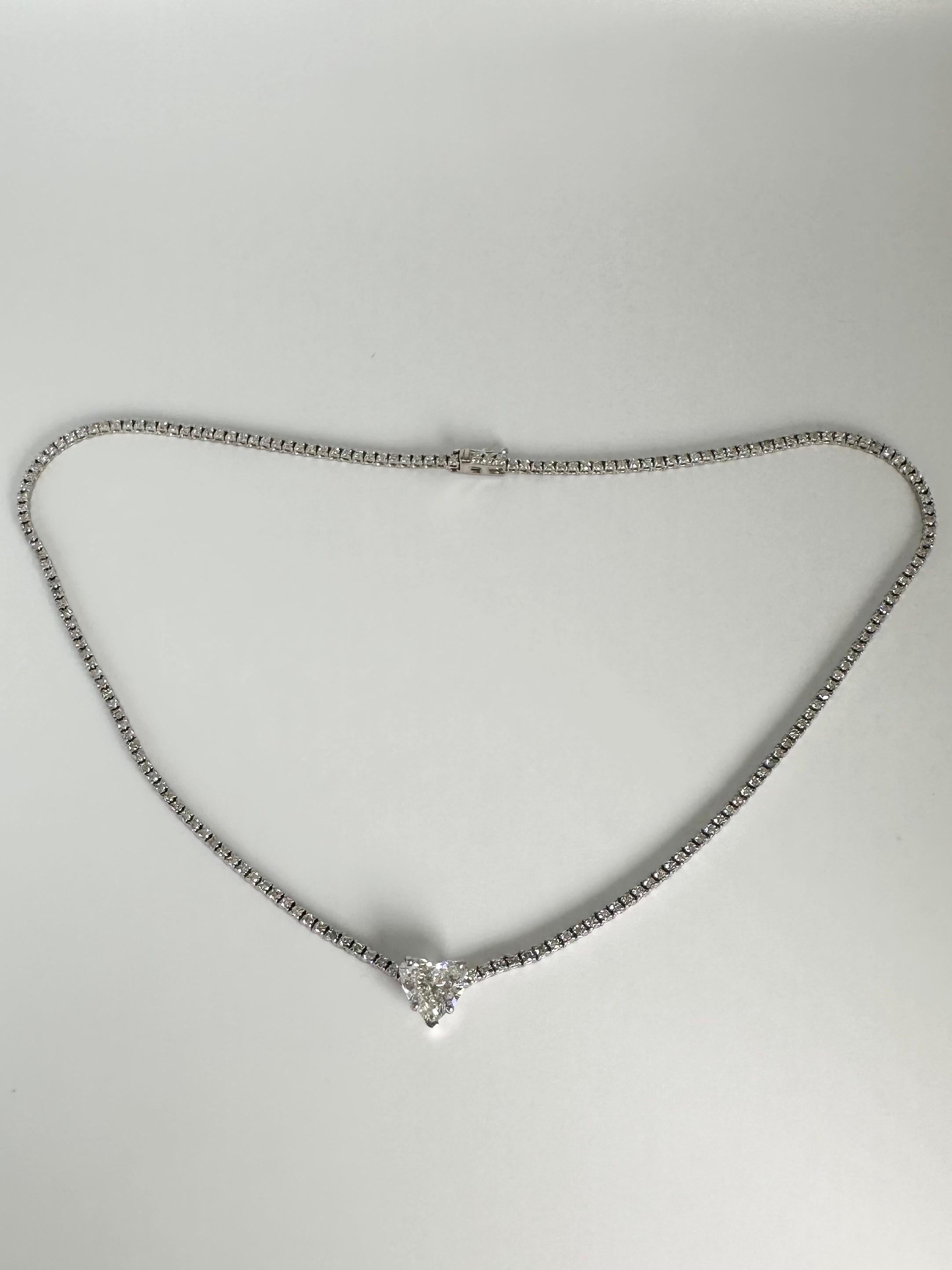 Fantastic workmanship, a beautiful elegant luxurious diamond tennis necklace with a large 3ct heart center, made in 18KT white gold with top quality diamonds and workmanship!

GOLD: 18KT gold
NATURAL DIAMOND(S)
Clarity/Color: VS/F
Carat:3ct (GIA