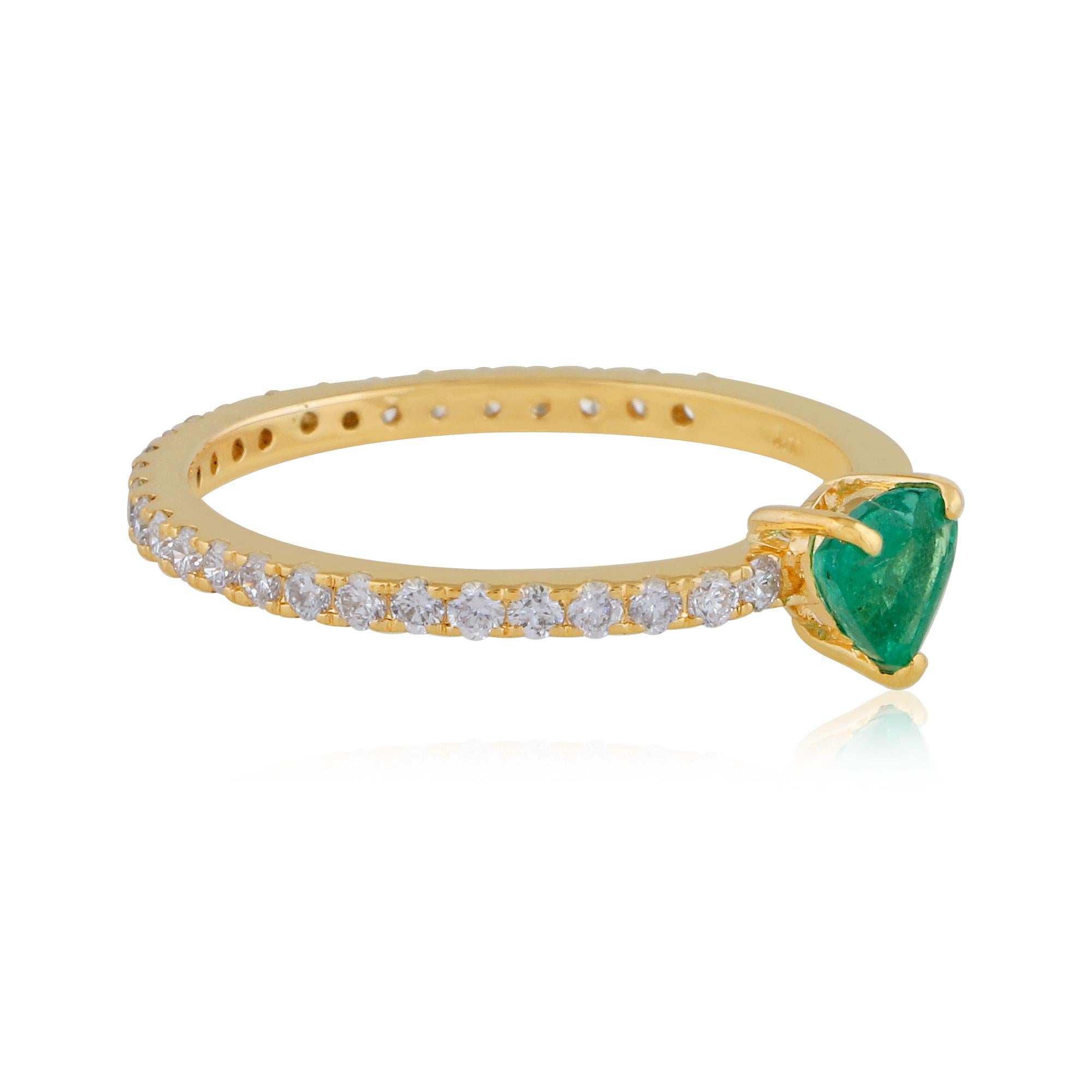 The heart-shaped emerald gemstone is the central focal point of the ring and represents love and affection. The emerald is carefully selected for its quality, including considerations of color, clarity, and carat weight. Its vibrant green color adds