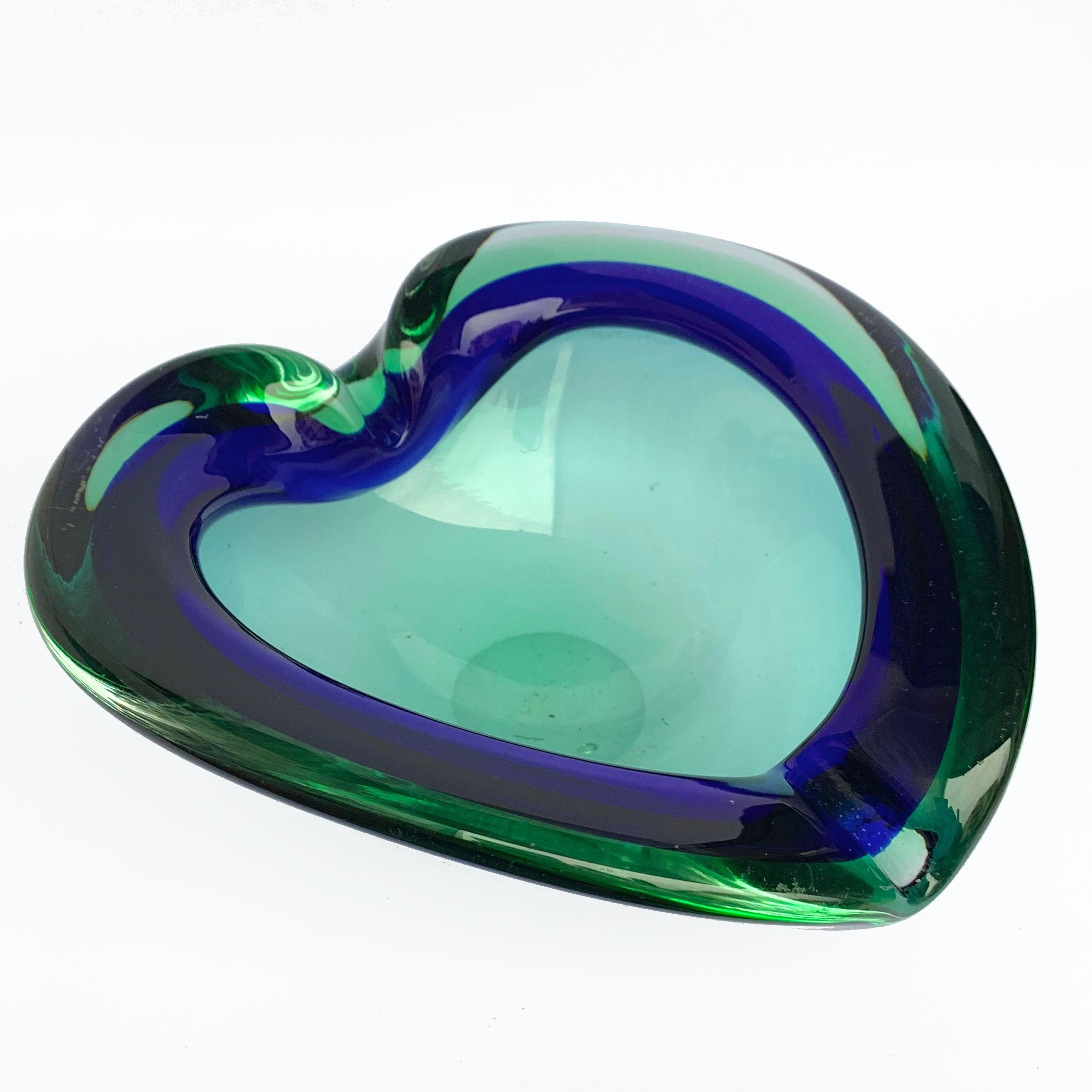 Heart-shaped, glass bowl or ashtray. Green and blue. Glass Sommerso Murano, Italy, 1960s.
No chipping, the one highlighted in red is an internal sign.