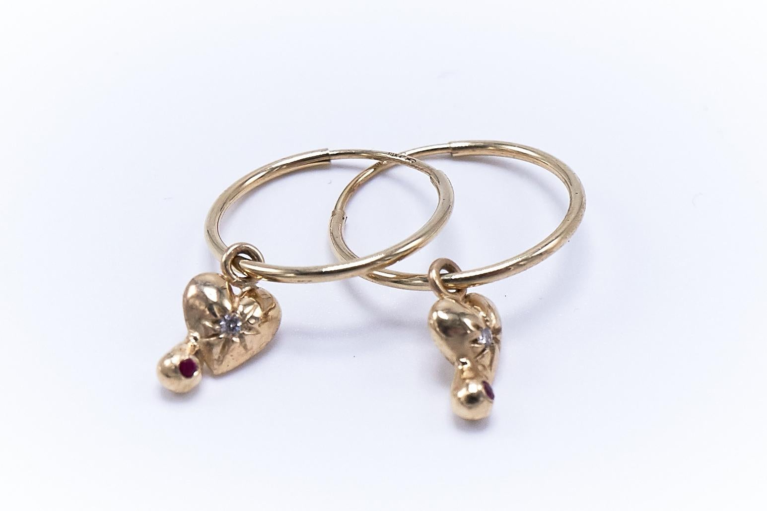 White Diamond Ruby Heart Earring Gold Hoop 

Designer: J Dauphin
Material: Solid 14 K Gold
Gems: White Diamondd and Ruby Brilliant cut
Style: 