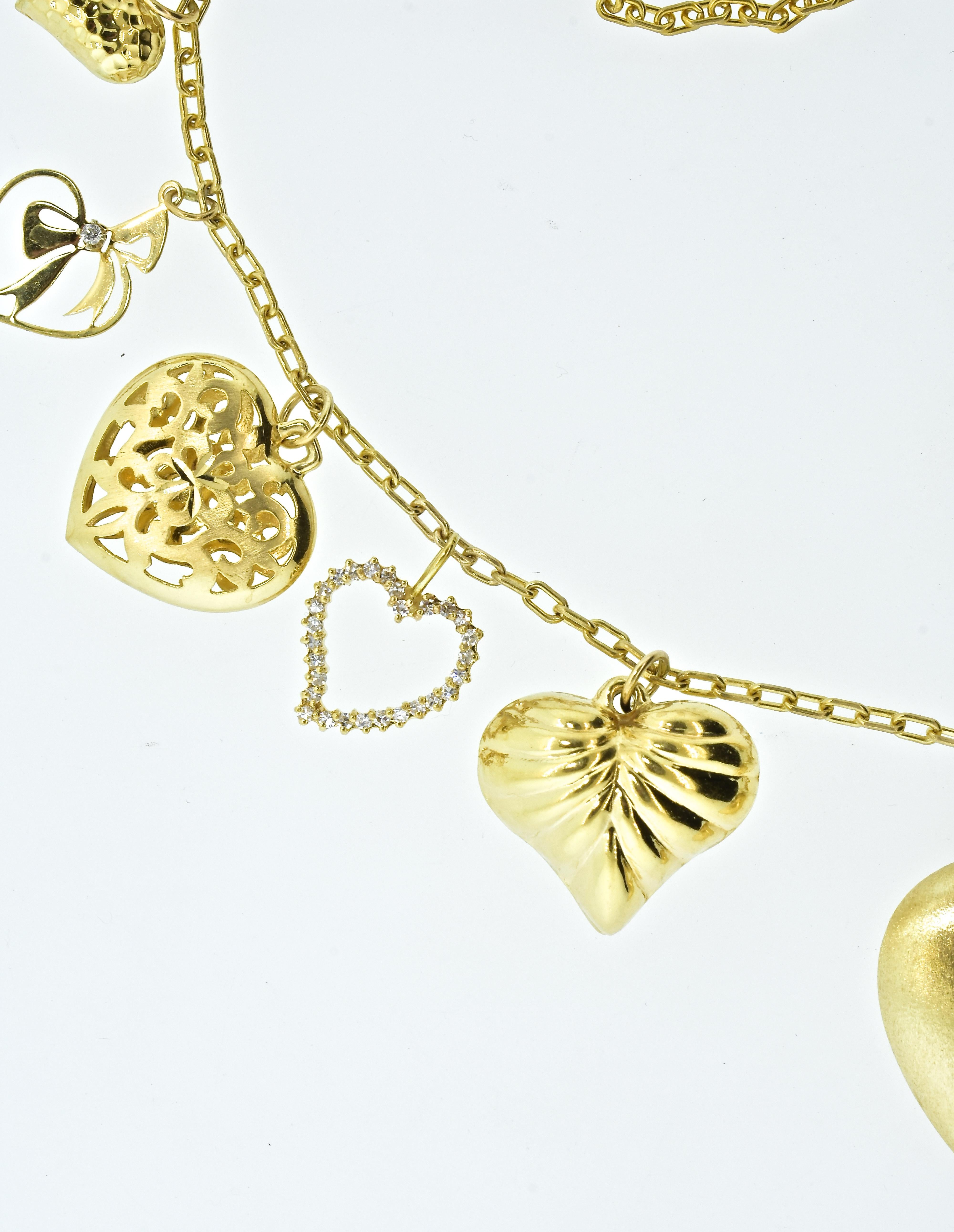 Heart pendants hang from a gold chain necklace, which is 23 inches long.  There are .70 cts of fine white diamonds set in 5 of the heart pendants.  One of the pendants is also a locket.  This necklace, with 11 different hearts, weighs 29 grams, it