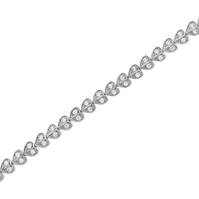 This delicate heart shaped tennis bracelet is a fun and modern twist to the classic tennis bracelets. 14K White Gold. 
Bracelet Information 
Width: 9 mm.
Length: 187 mm.
Weight: 18.7 g. (approx. in total)
Clasp: Push Clasp
Gemstones 
Type: