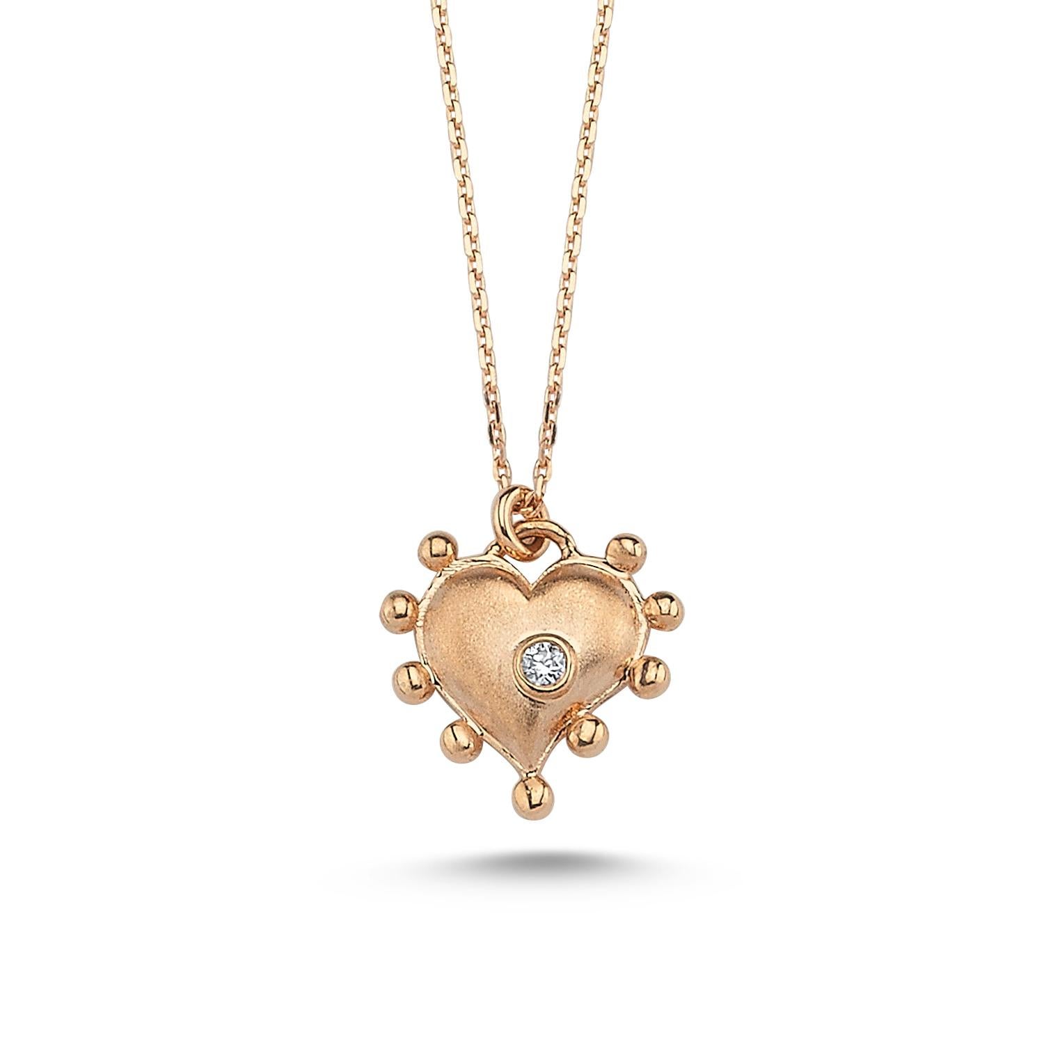 Heart necklace in 14k rose gold with 0.01ct white diamond by Selda Jewellery

Additional Information:-
Collection: Art of giving collection
14K Rose gold
0.01ct White diamond
Pendant height 1cm
Chain length 42cm