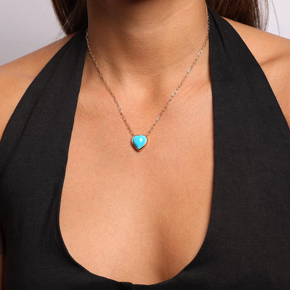 The heart is synonymous with affection, it is a symbol of love. Our Heart of Gold Necklace is elegance and minimalism at its finest as it features a deep blue heart shaped turquoise cabochon set in a delicate gold bezel. It dangles from a modern 18