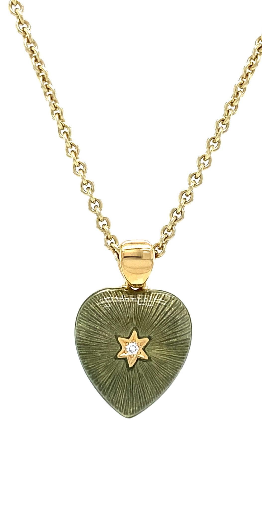 Victor Mayer heart shaped two colored pendant necklace 18k yellow gold, olive green and yellow vitreous enamel, 2 diamonds, total 2.02 ct, G VS, measurements app. 11.8 mm x 13.0 mm

About the creator Victor Mayer
Victor Mayer is internationally