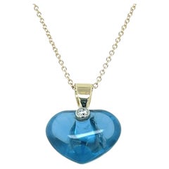 Heart Pendant Sky Blue Topaz 13 Carats with natural Diamond 14KYG