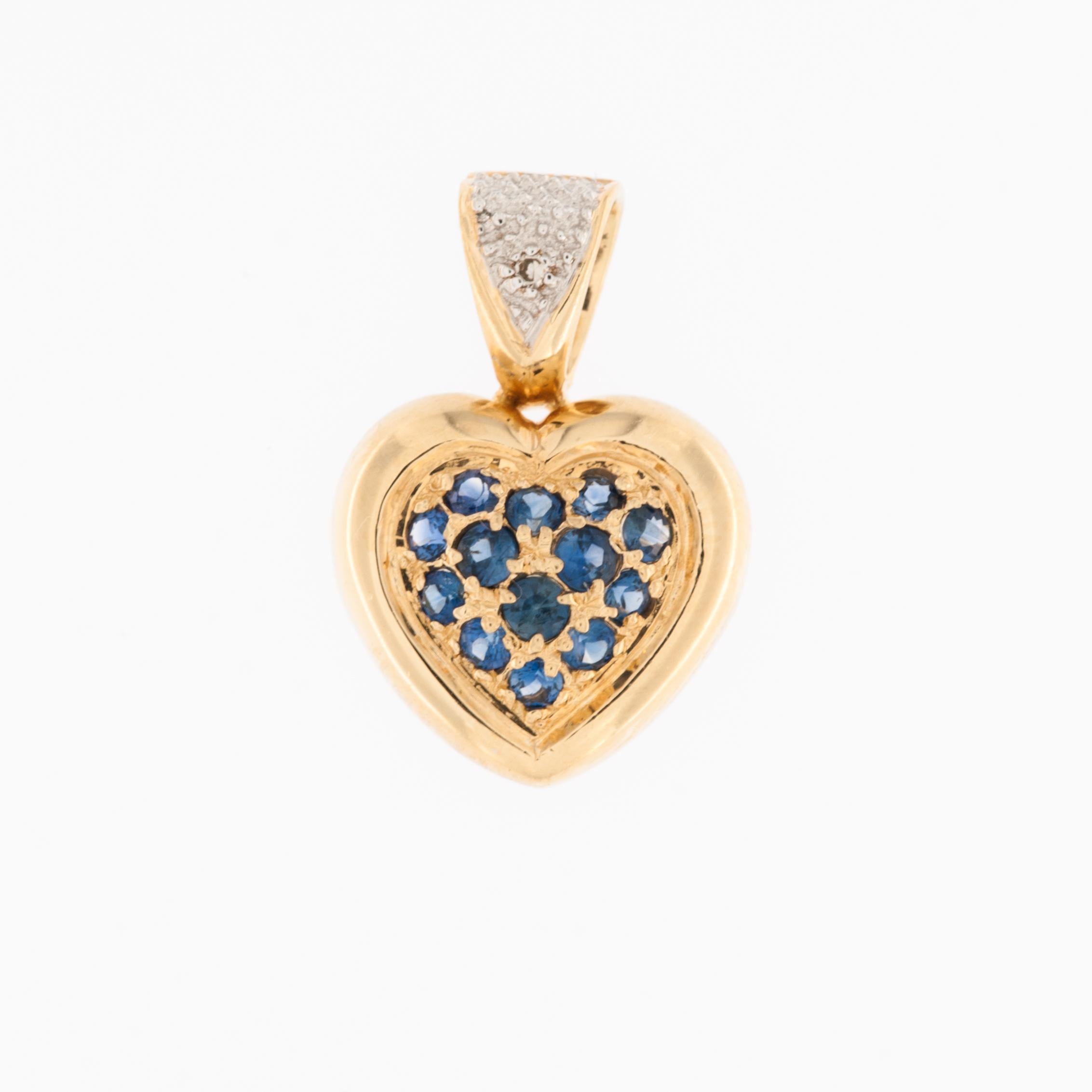 The Heart Pendant crafted in Yellow and White Gold is a radiant expression of elegance and sophistication. Fashioned in 18-karat gold, this pendant seamlessly blends the warm glow of yellow gold with the lustrous sheen of white gold, creating a
