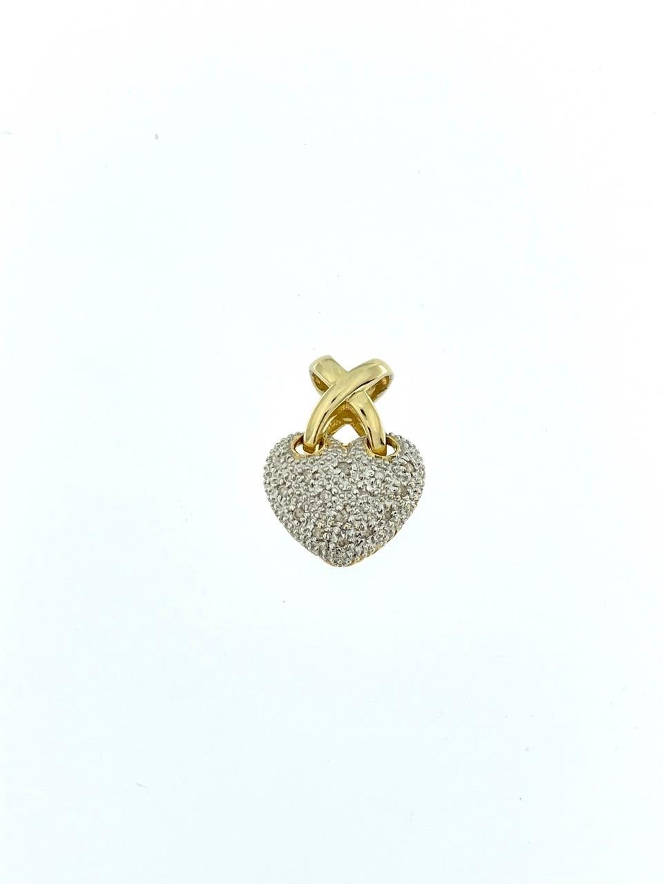 The Heart Pendant in Yellow and White Gold with Diamonds is a stunning and romantic piece of jewelry that combines classic design with luxurious elements. Crafted with precision and elegance, this pendant is a beautiful expression of love and