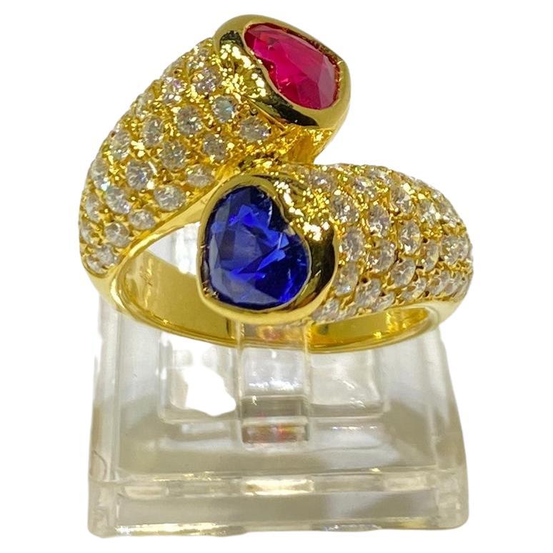 This ring features a 1.15 carat heart ruby and 1.25 carat heart blue sapphire, assented with 1.51 carat round brilliant cut diamonds.  Great for everyday use and would make a special gift for your loved one. 

Ruby 1.15 carat 
Blue Sapphire 1.25