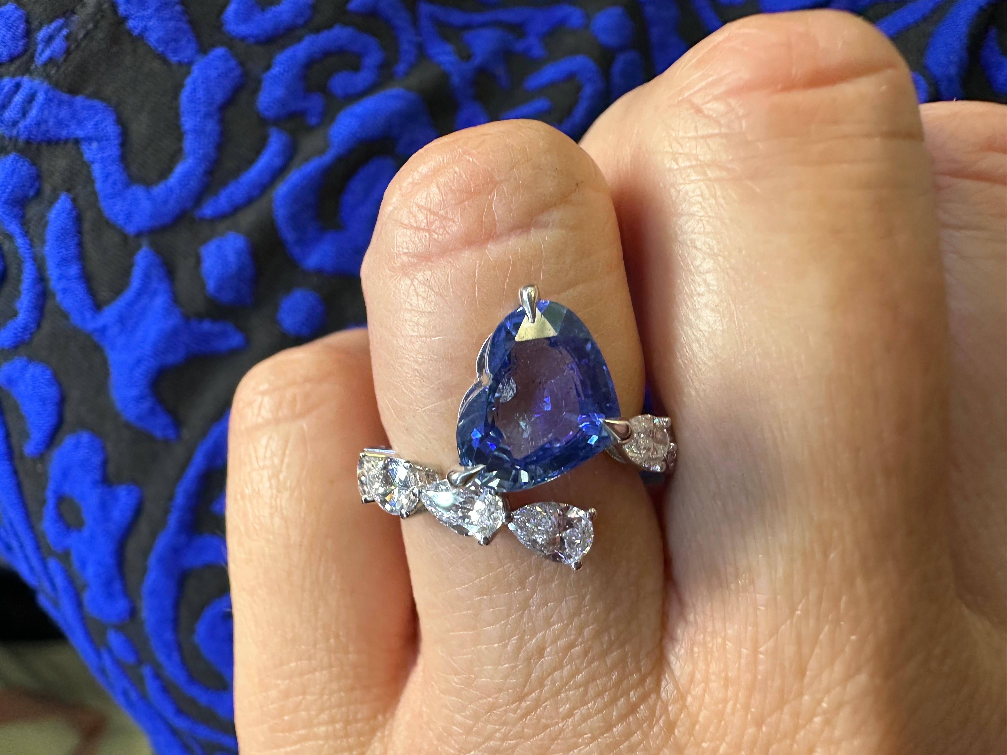 Gorgeous heart sapphire & diamond ring in platinum, very unique modern design!

Metal Type: platinum
Natural Sapphire(s):
Color: Blue
Cut: Heart
Carat: 4.38ct
Clarity: Slightly Included

Natural Diamond(s): 
Color: F-G
Cut:Pear Brilliant
Carat: