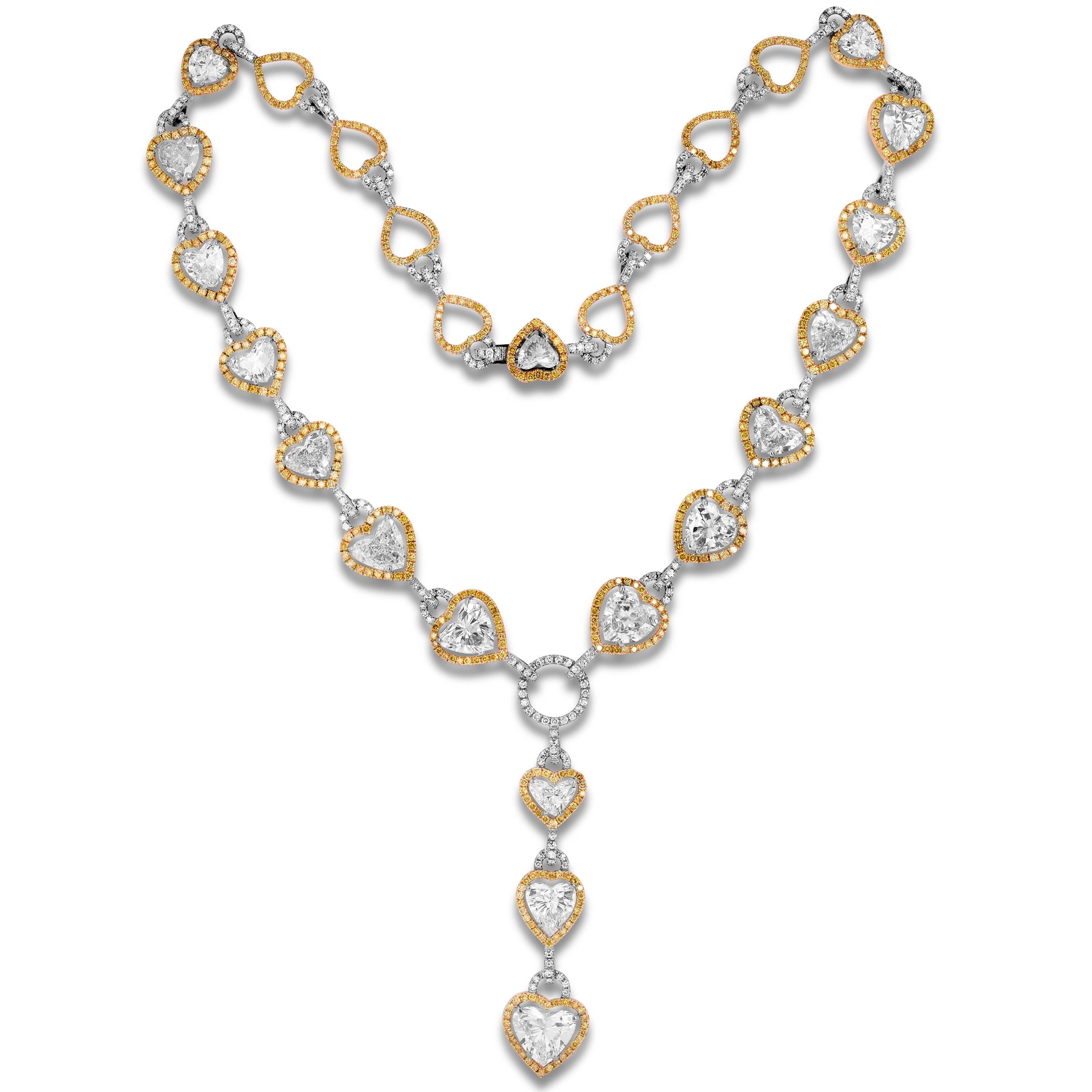 18K Yellow Gold Matching Necklace and Earrings Set with Heart Shape and Fancy Yellow Diamonds 

This one-of-a-kind set is truly exceptional with heart shape and yellow, white diamonds set all throughout

Apprx. 52 carats J-K color, VS1-VS2 clarity