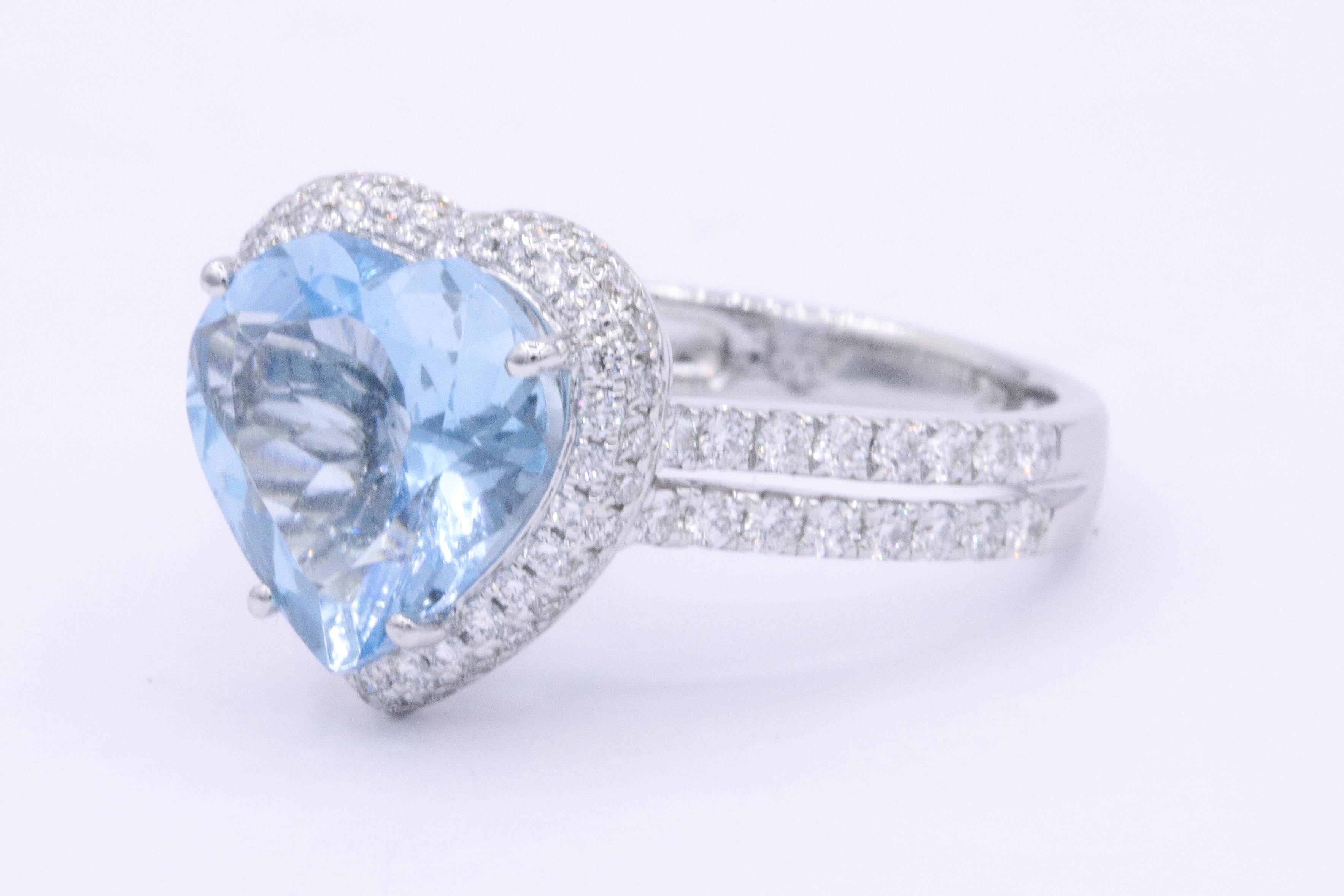 18K White gold ring featuring one heart shaped Aquamarine weighing 3.47 carats flanked with round brilliants weighing 0.80 carats. Color G-H Clarity VS-SI
10x 11 mm
