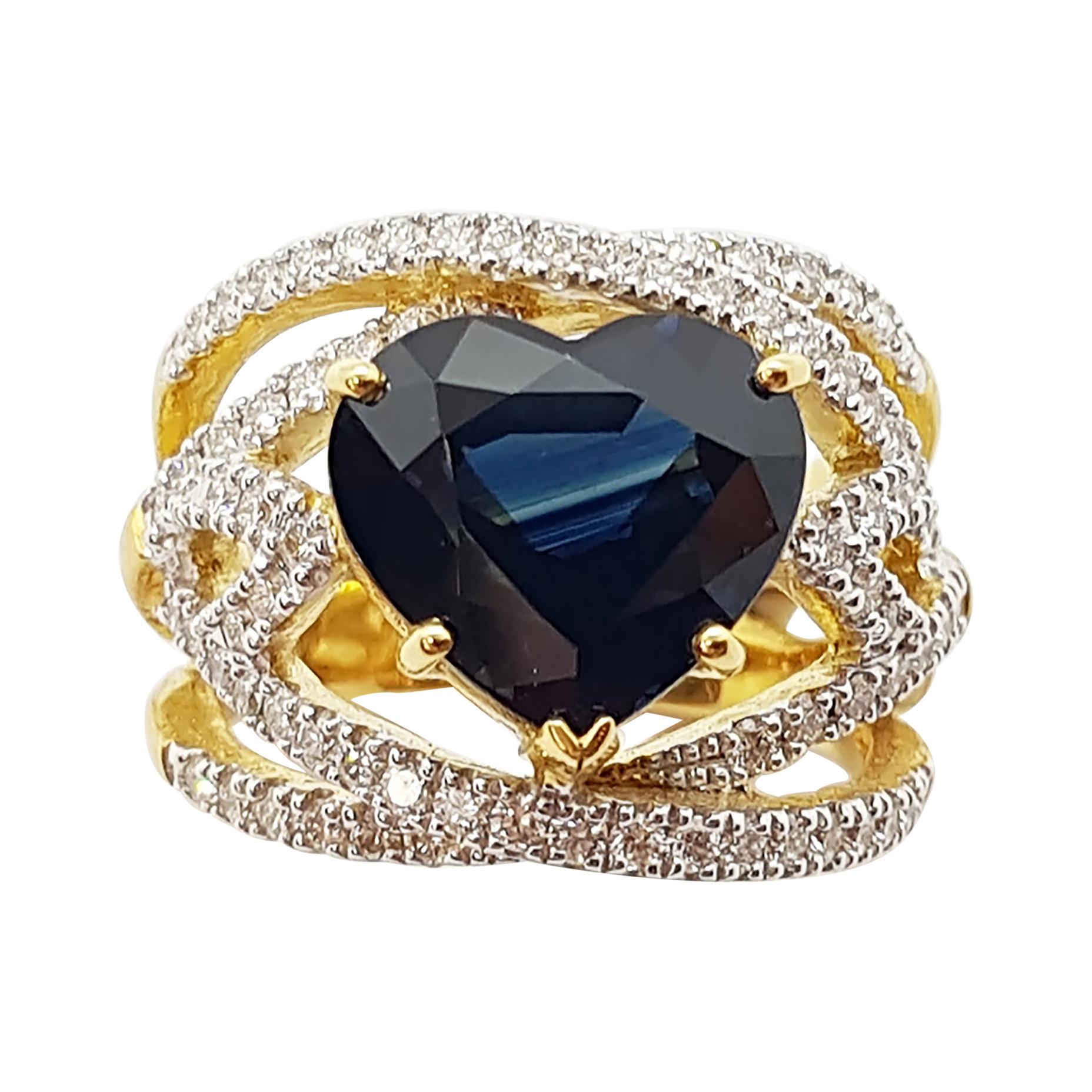 Bague en or 18 carats sertie d'un saphir bleu en forme de cœur et de diamants