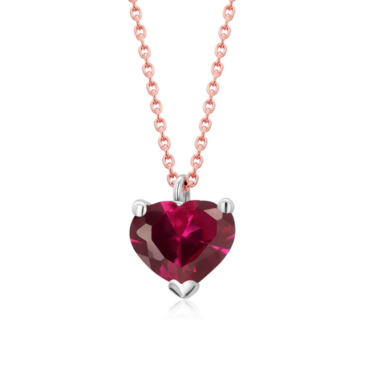 Fourteen karats white and rose gold trending layered necklace pendant with hanging heart shape red ruby
Heart shape ruby weighing 1.00 carat
Chain measuring 16 inches long
Ruby measuring 6 millimeters. 0.25 inch
Cable chain necklace with spring