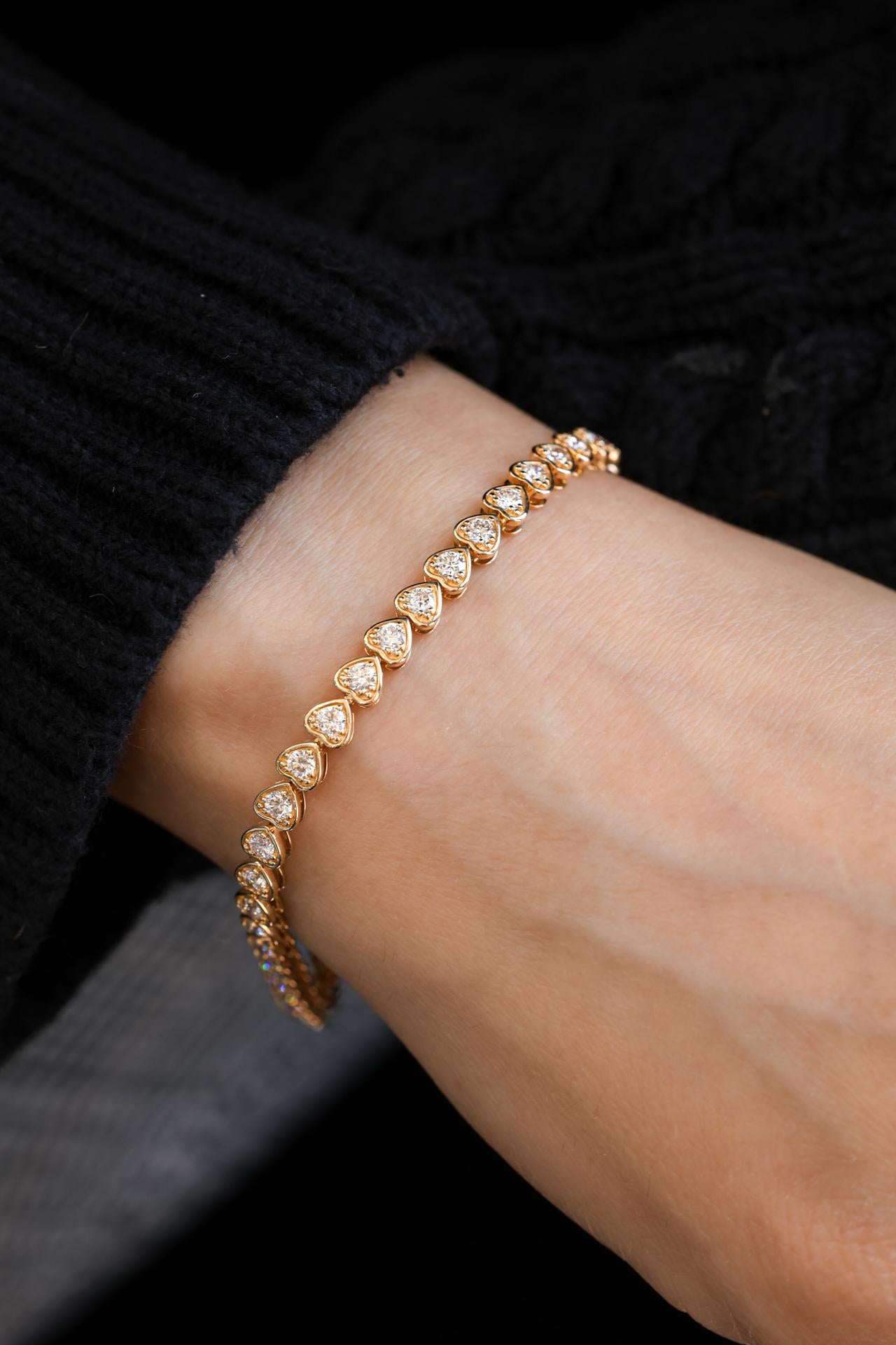 -14K Yellow Gold 

-42 Round Diamonds 

-Heart Shape Bezel Setting 

-2.63 