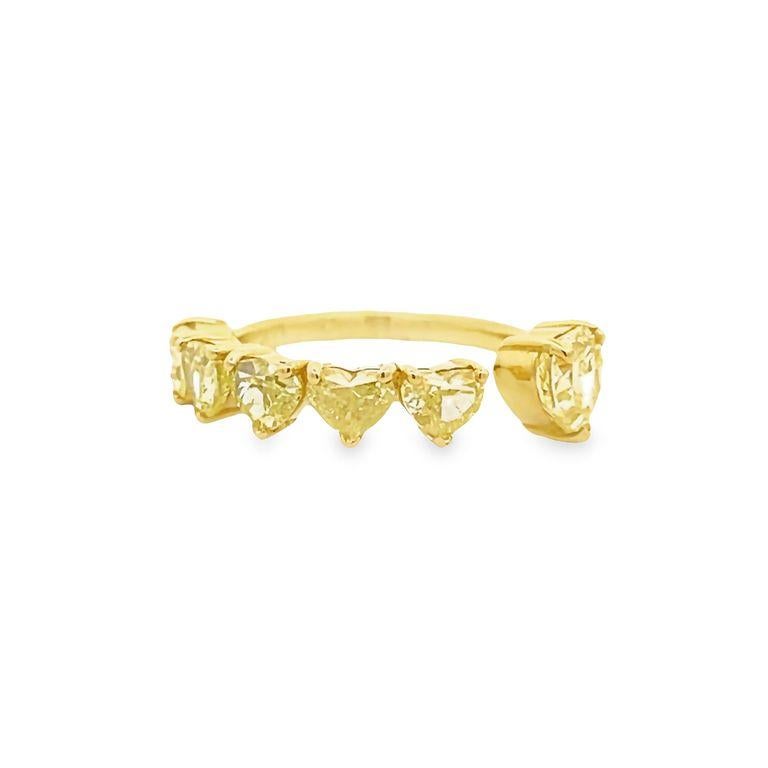 Introducing a stunning yellow heart-shaped fashion ring with six yellow diamonds. On the left side of the ring, you will find five beautiful stones weighing a total of 2.12 carats, while the right side features a stunning fancy yellow heart-shaped
