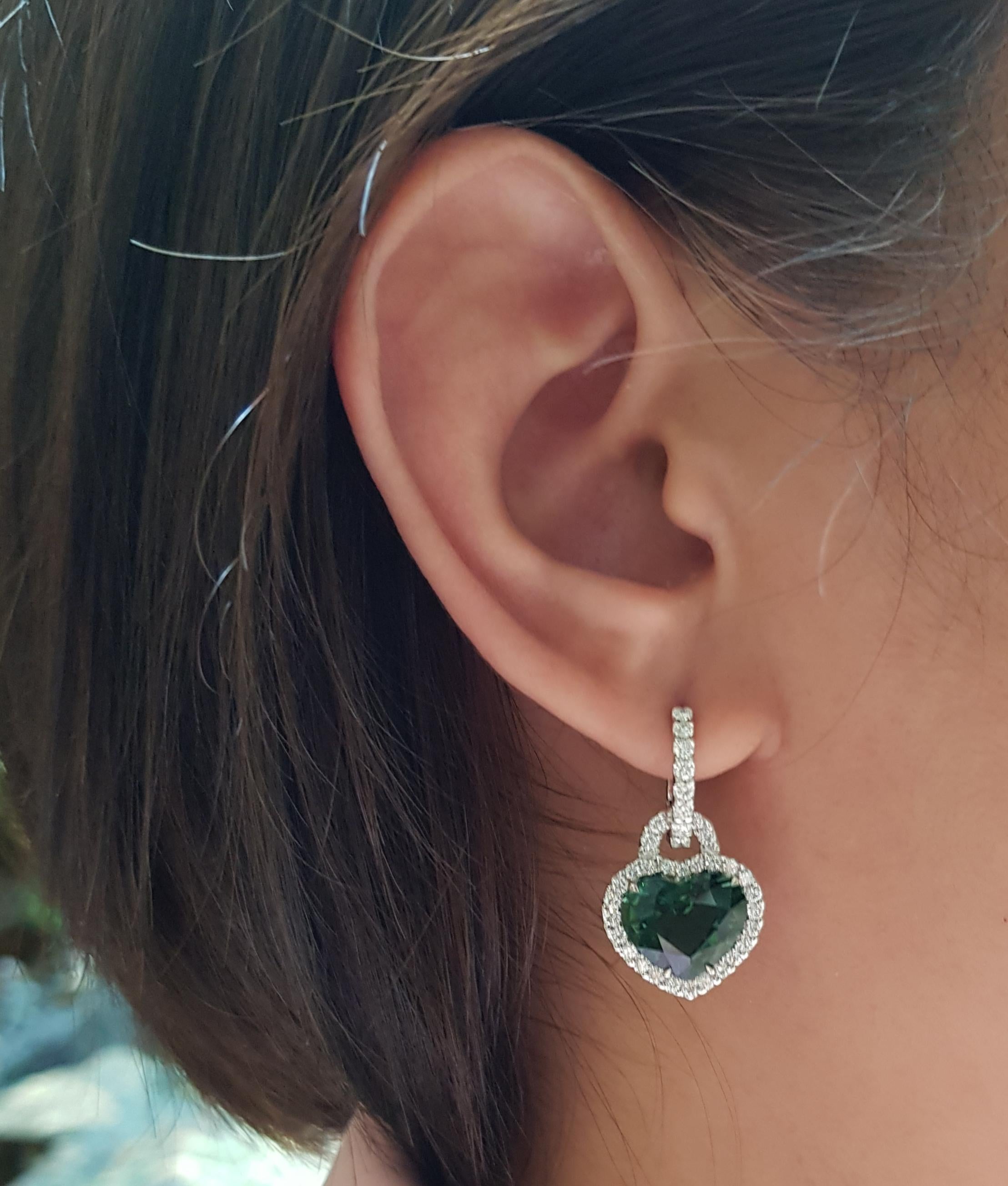 Green Tourmaline 9.49 carats with Diamond 1.24 carats Earrings set in 18 Karat White Gold Settings

Width:  1.6 cm 
Length: 2.6 cm
Total Weight: 7.43 grams

