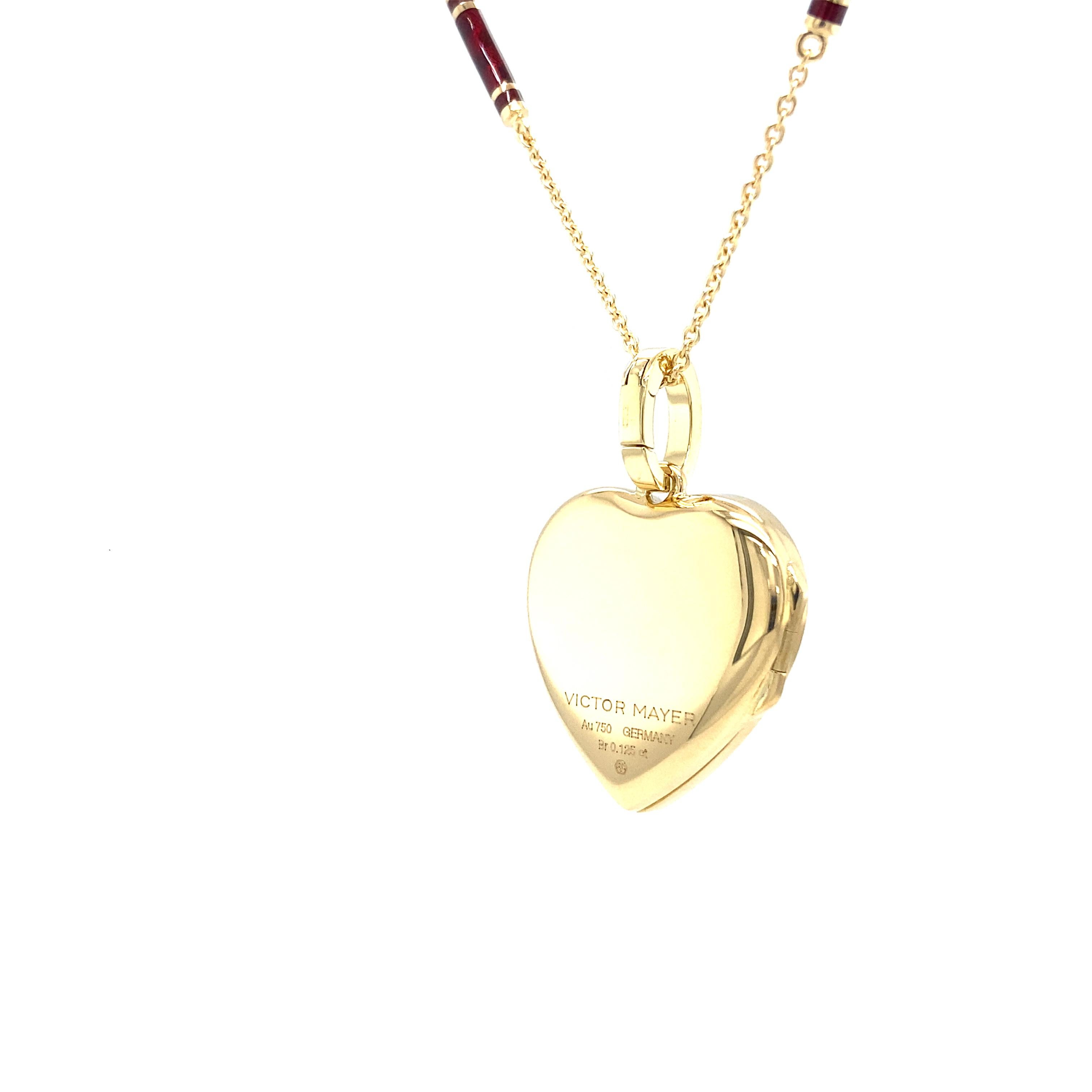 Victor Mayer heart shaped locket pendant, 18k yellow gold, pink and burgundy red vitreous enamel, 6 diamonds, total 0.12 ct, H VS

About the creator Victor Mayer 
Victor Mayer is internationally renowned for elegant timeless designs and unrivalled