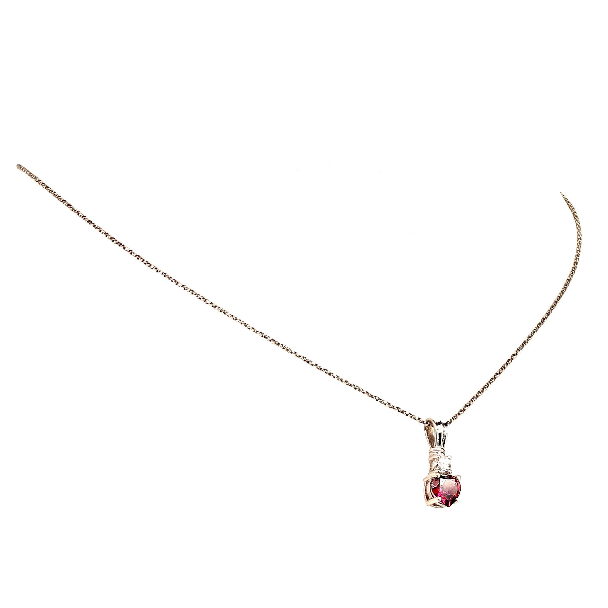 
Sparkling Rhodolite Heart Shape Garnet, 1.21 carats enhanced with real, natural zircon of 0.42 carats in sterling silver pendant. This lovely pendant has the special character of Rhodolites, purply-red flashes! The entire length of the pendant is