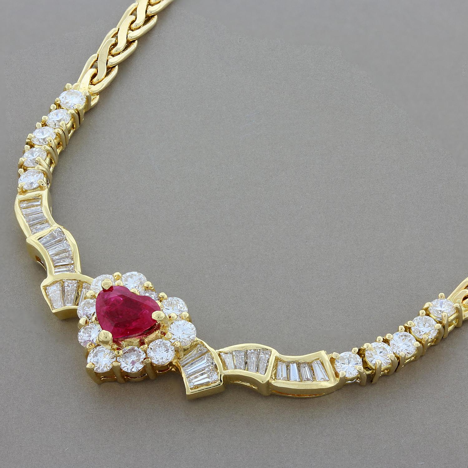 This beautifully designed necklace features a 0.91 carat heart shaped ruby accented by 2.37 carats of VS quality round and baguette cut diamonds. The 18K yellow gold setting has a quilted chain with a lobster claw clasp for a secure