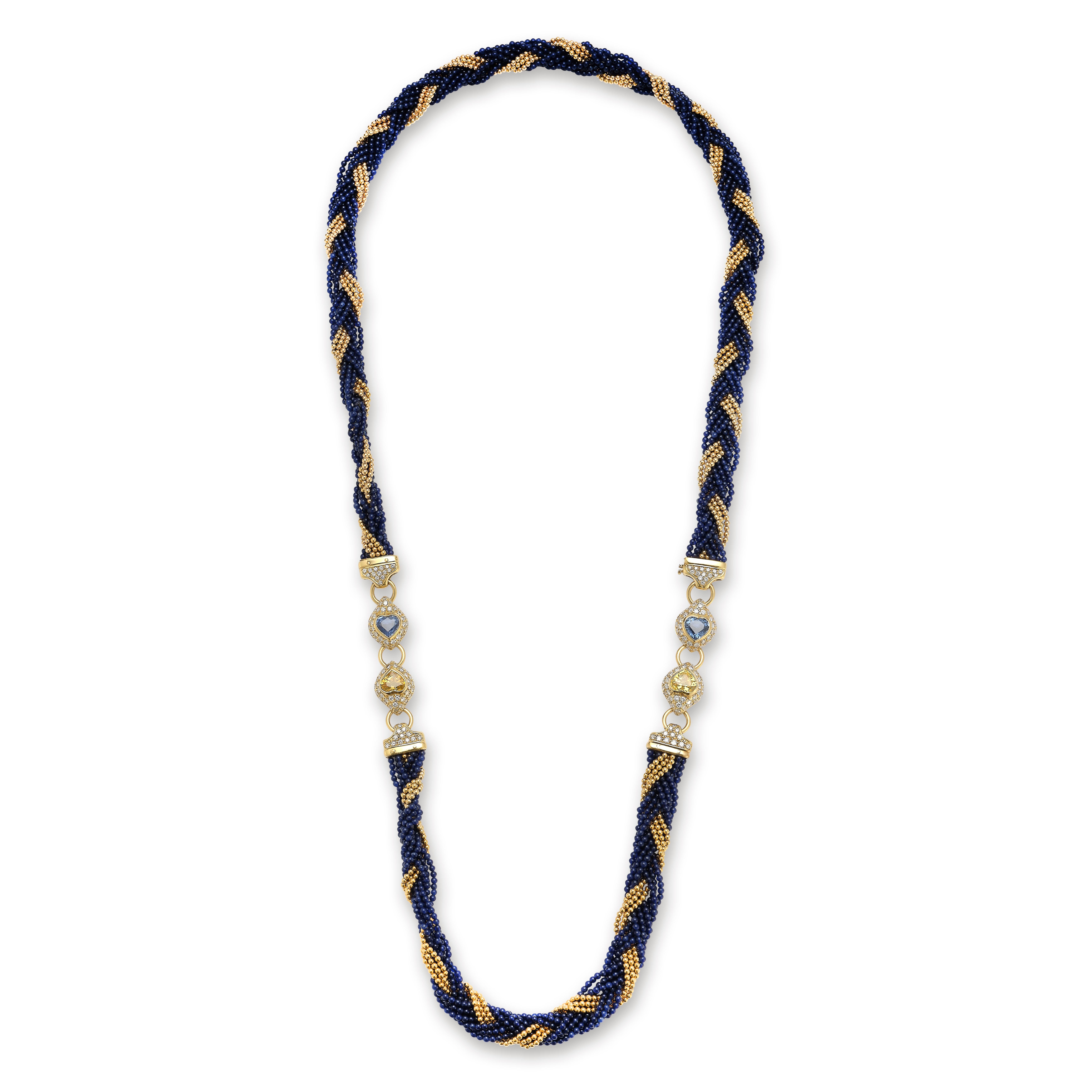 Sapphire & Gold Bead Diamond Necklace

Multi strands of 18 karat gold & blue glass beads attaching set with diamonds & heart shape sapphires.

Yellow Sapphire Weight: approximately 6.06 cts 
Blue Sapphire Weight: approximately 6.06 cts 
Diamond