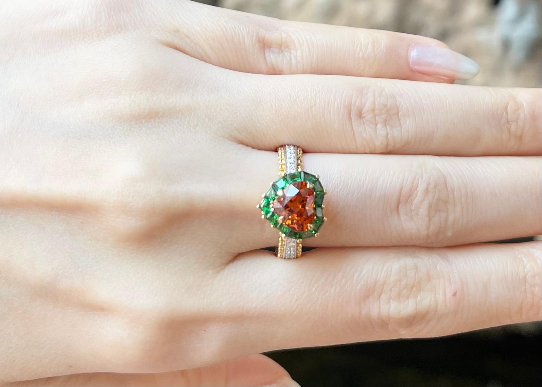 Spessartite Garnet 2.30 carats, Tsavorite 1.38 carats and Diamond 0.20 carat Ring set in 18K Gold Settings

Width:  1.1 cm 
Length: 1.2 cm
Ring Size: 54
Total Weight: 7.57 grams

