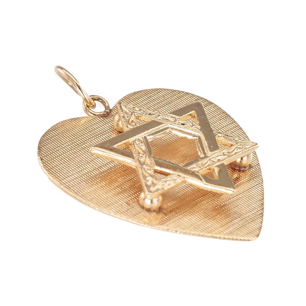 Vintage heart-shaped Star of David yellow gold charm pendant circa 1960.  Love it because it caught your eye, with its three dimensional design.  Shinny and textured finish.  Make yourself happy!  Simple and concise information you want to know is