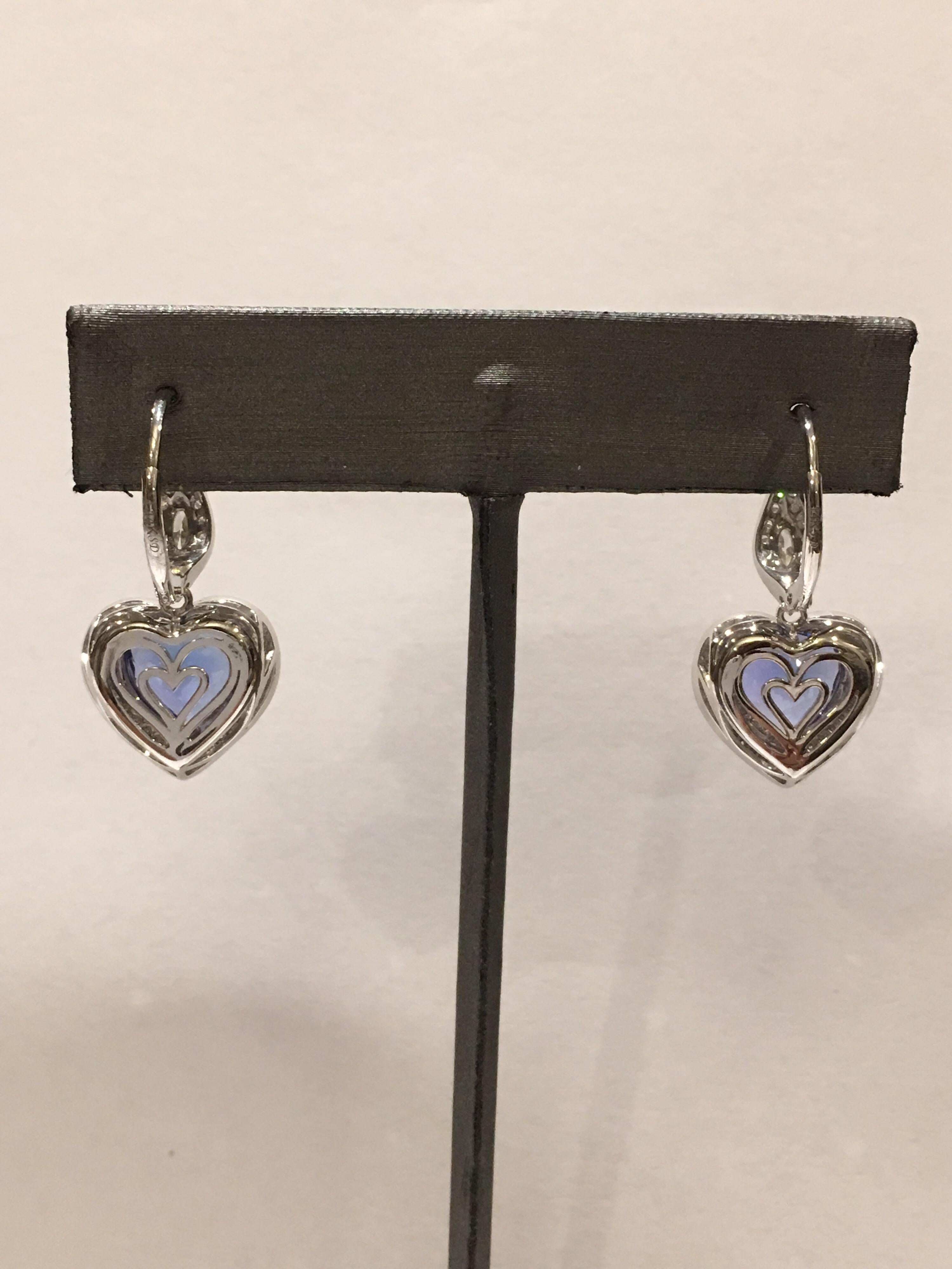 Royal Blue AAA Tanzanite is Heart Shape  set with 1.11 Carat diamonds set in 14K White gold.