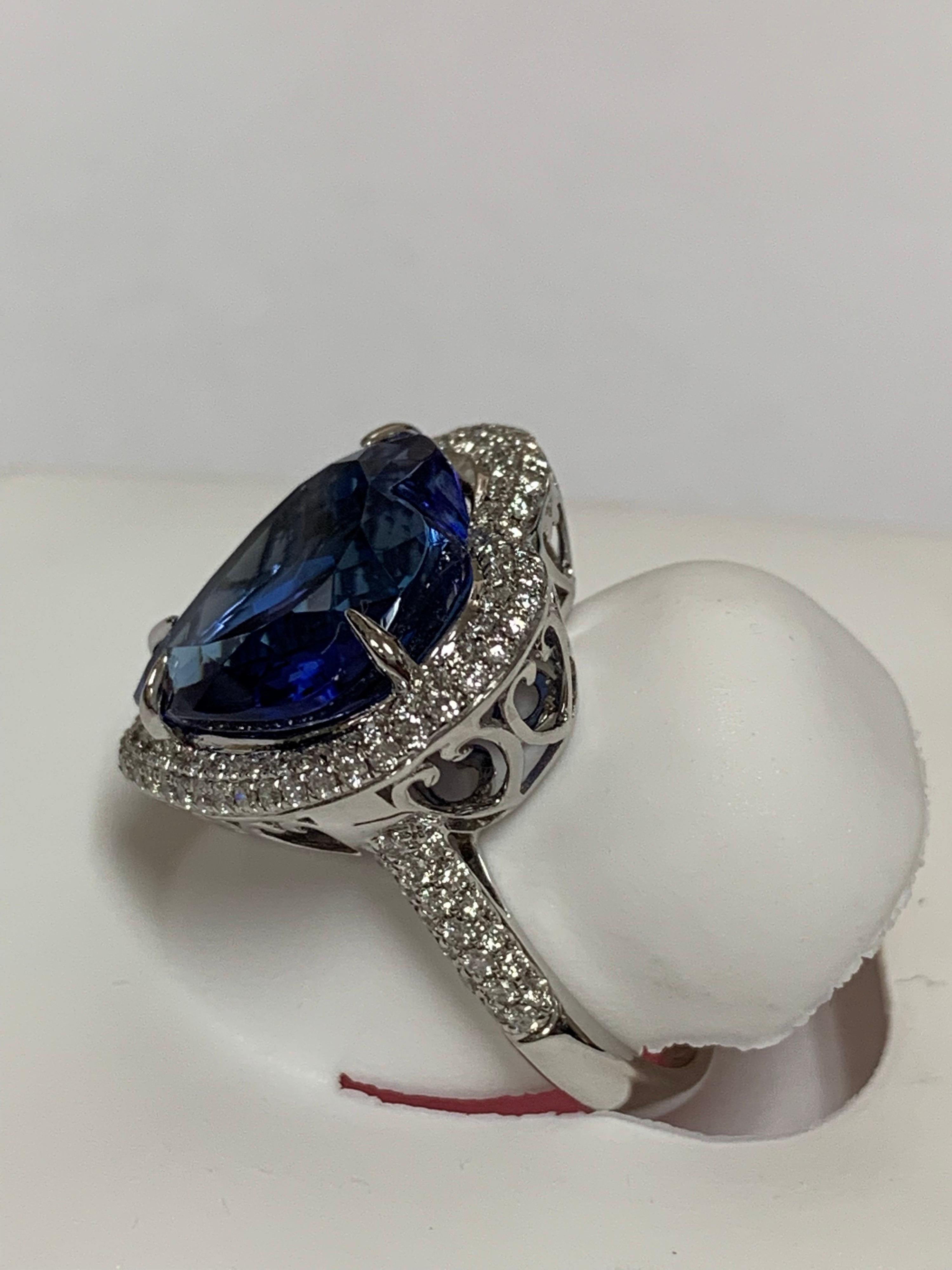 Heart shape Tanzanite 9.83 Carat  and 0..78 carat white round diamonds set in 14 Karat gold is one of a kind hand crafted ring. The size of the ring is 7 and can be resized if needed. 