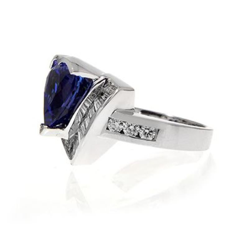 18k White Gold 5.90ct Heart Shape Tanzanite Ring with 1.66ct Diamonds
The finest quality Tanzanite, mined from the foothills of Mount
Kilimanjaro, exhibits a rich purplish blue. Takat uses only the best
examples of this hue to take center stage in
