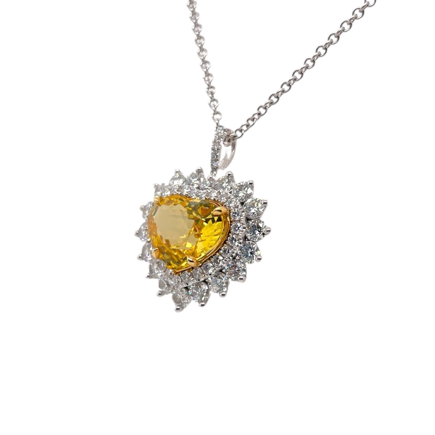 One of a kind heart shape yellow sapphire, 5.17cts and 43 round brilliant diamonds surrounding center stone, 1.70tcw. Diamonds within halo are near colorless and VS in clarity, excellent cut. All stones are mounted in handmade prong setting. Pendant