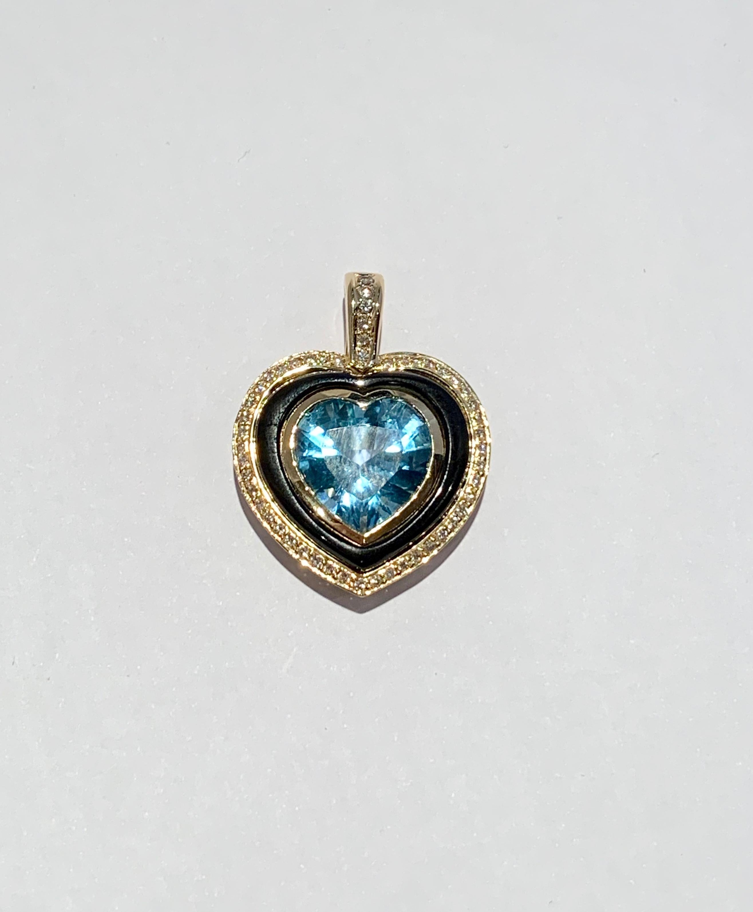 This truly is a unique and elegant pendant and would make a great talking point.  The Heart Shaped 10ct Swiss Blue Topaz is a medium blue with wonderful clarity and measures 15.5 x 13.5 approximately.  The Topaz is bezel set in a 9ct Yellow Gold