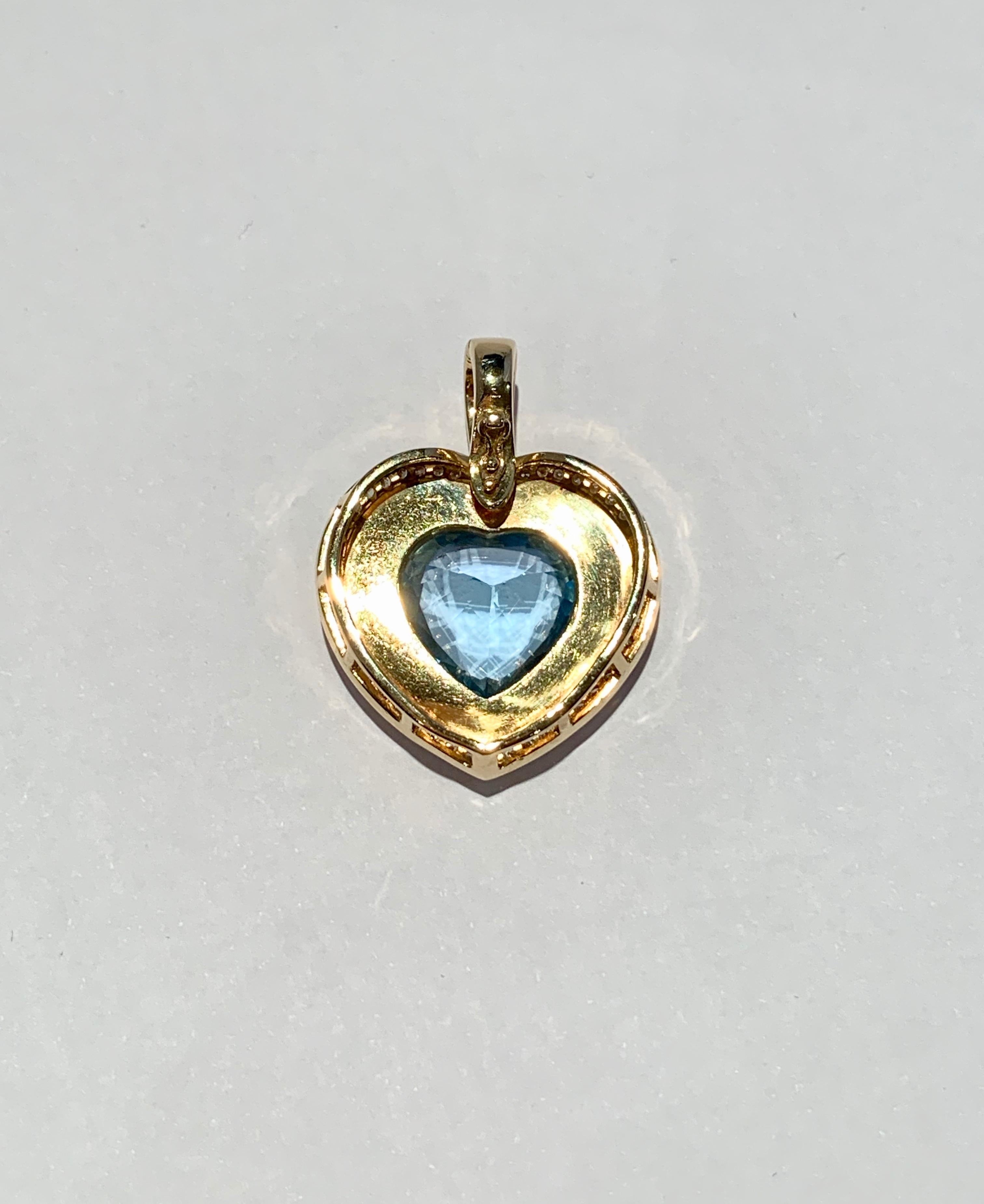 Modern Heart Shaped 10 Carat Blue Topaz Onyx and Diamond Pendant in 9 Carat Yellow Gold For Sale